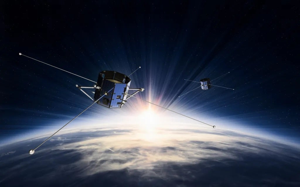 An artist’s concept shows NASA’s Tandem Reconnection and Cusp Electrodynamics Reconnaissance Satellites (TRACERS) satellites in space. The mission will study magnetic reconnection, when activity from the sun interacts with the region around the Earth dominated by its magnetic field.