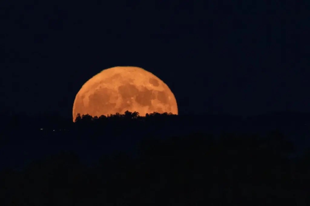 A supermoon rises over Huntsville, Alabama, last August. Supermoons are the biggest and brightest full mons of the year. The last supermoon rise, the full beaver moon, rises on Friday.