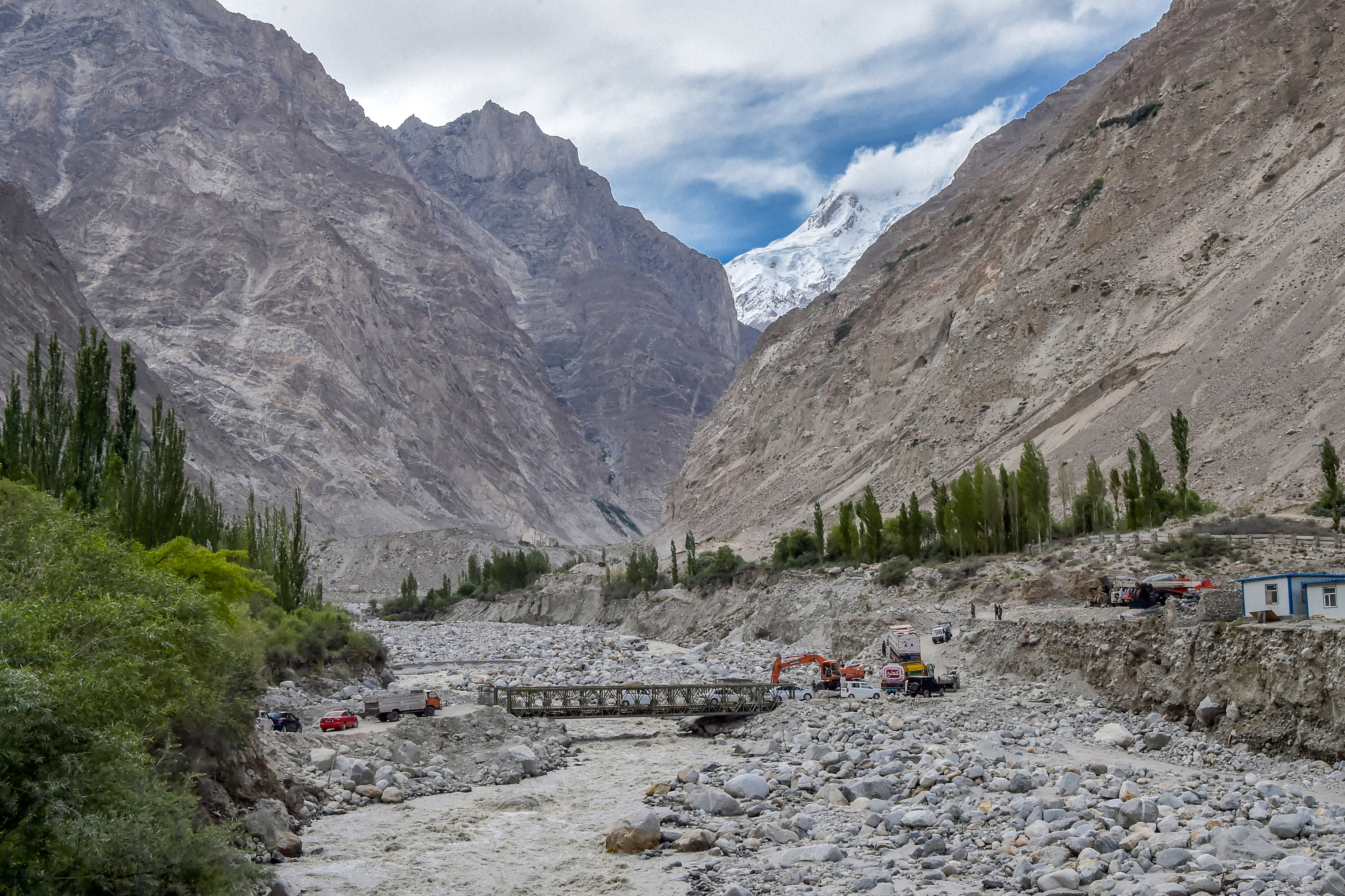 File. A bridge is swept away by a lake outburst at Hassanabad village of Gilgit-Baltistan region, Pakistan