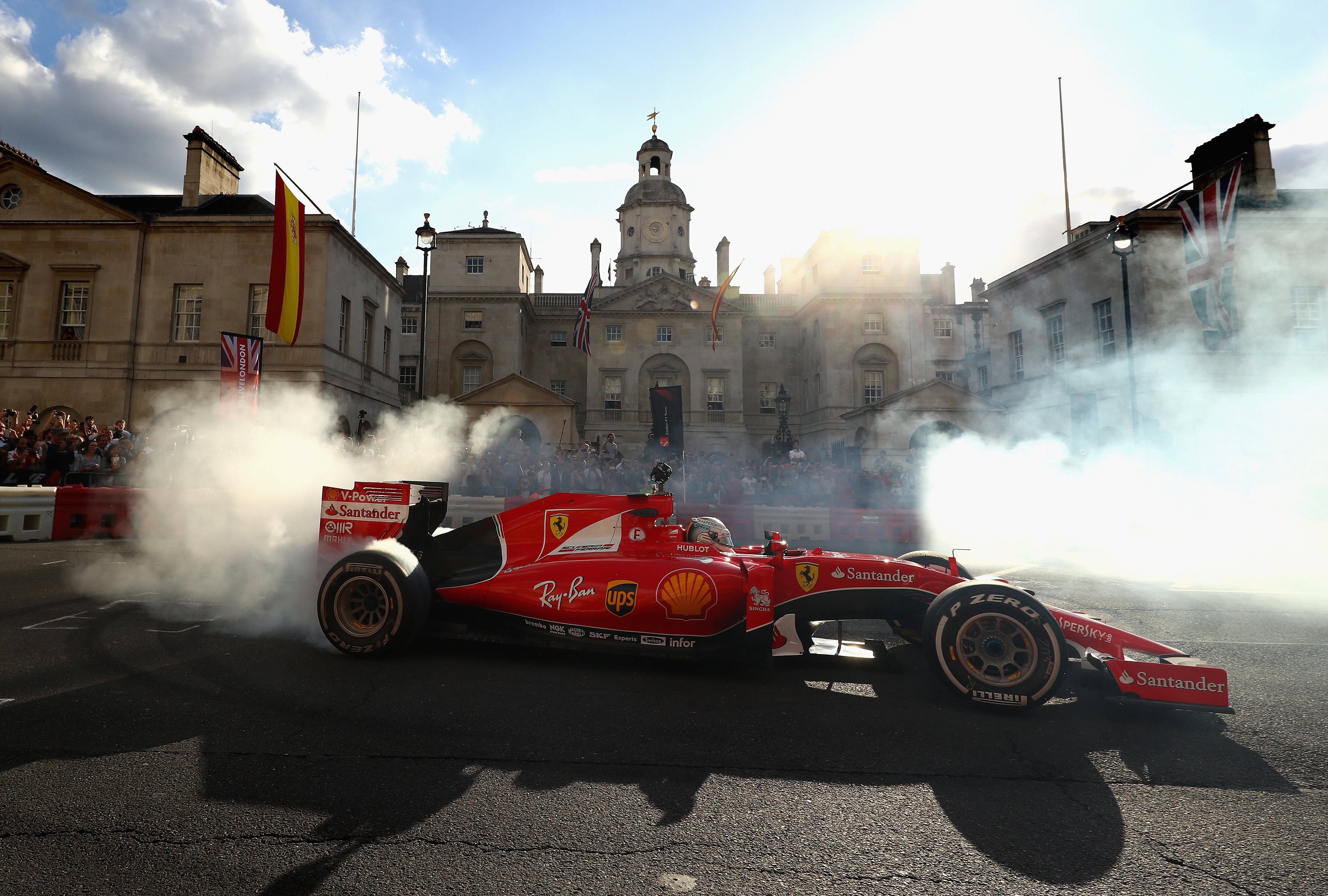 Sebastian Vettel performs doughnuts in his Ferrari car at F1 Live London in 2017