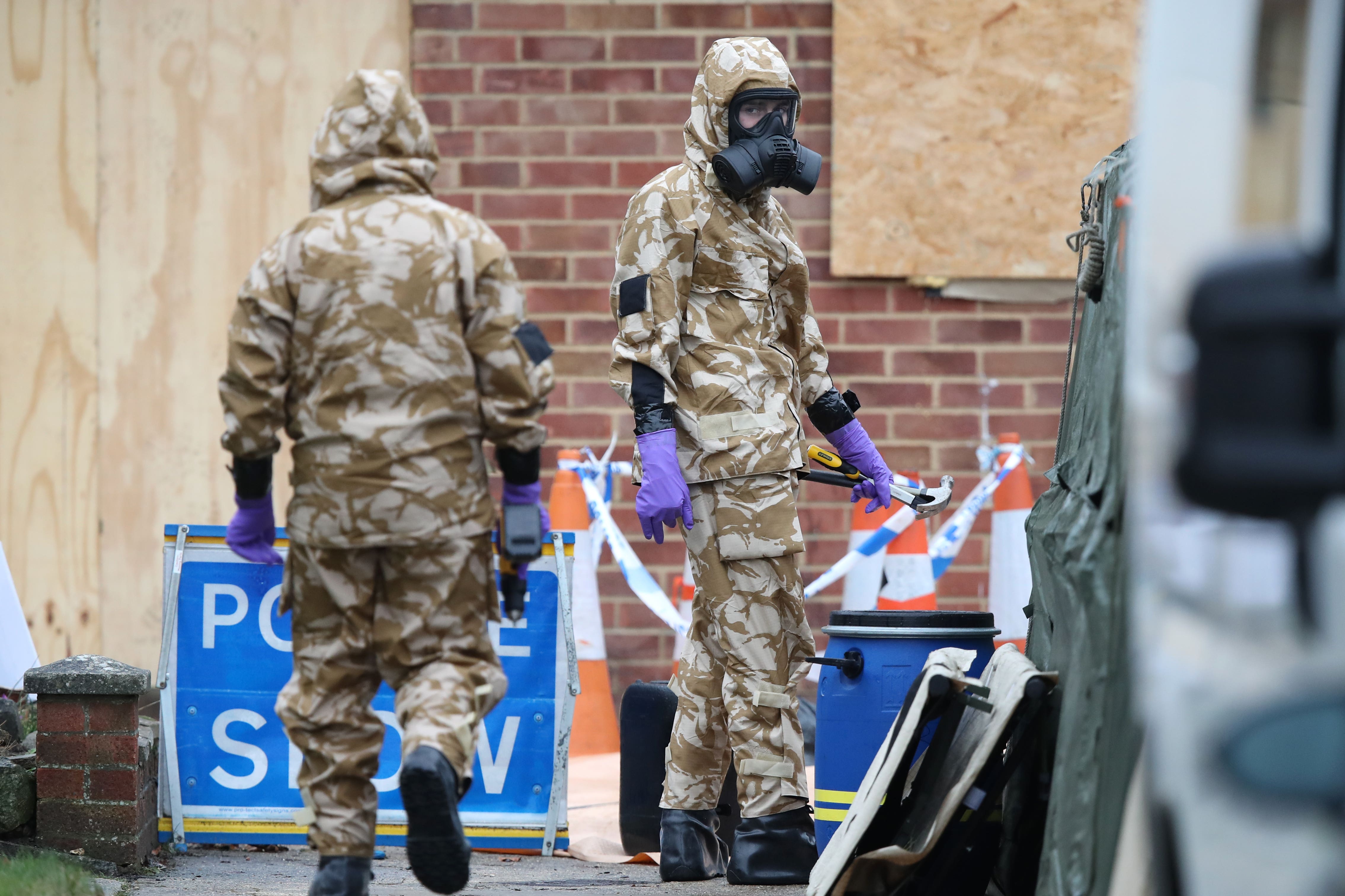 Members of the military wearing protective clothing at the home of Sergei Skripal (Andrew Matthews/PA)