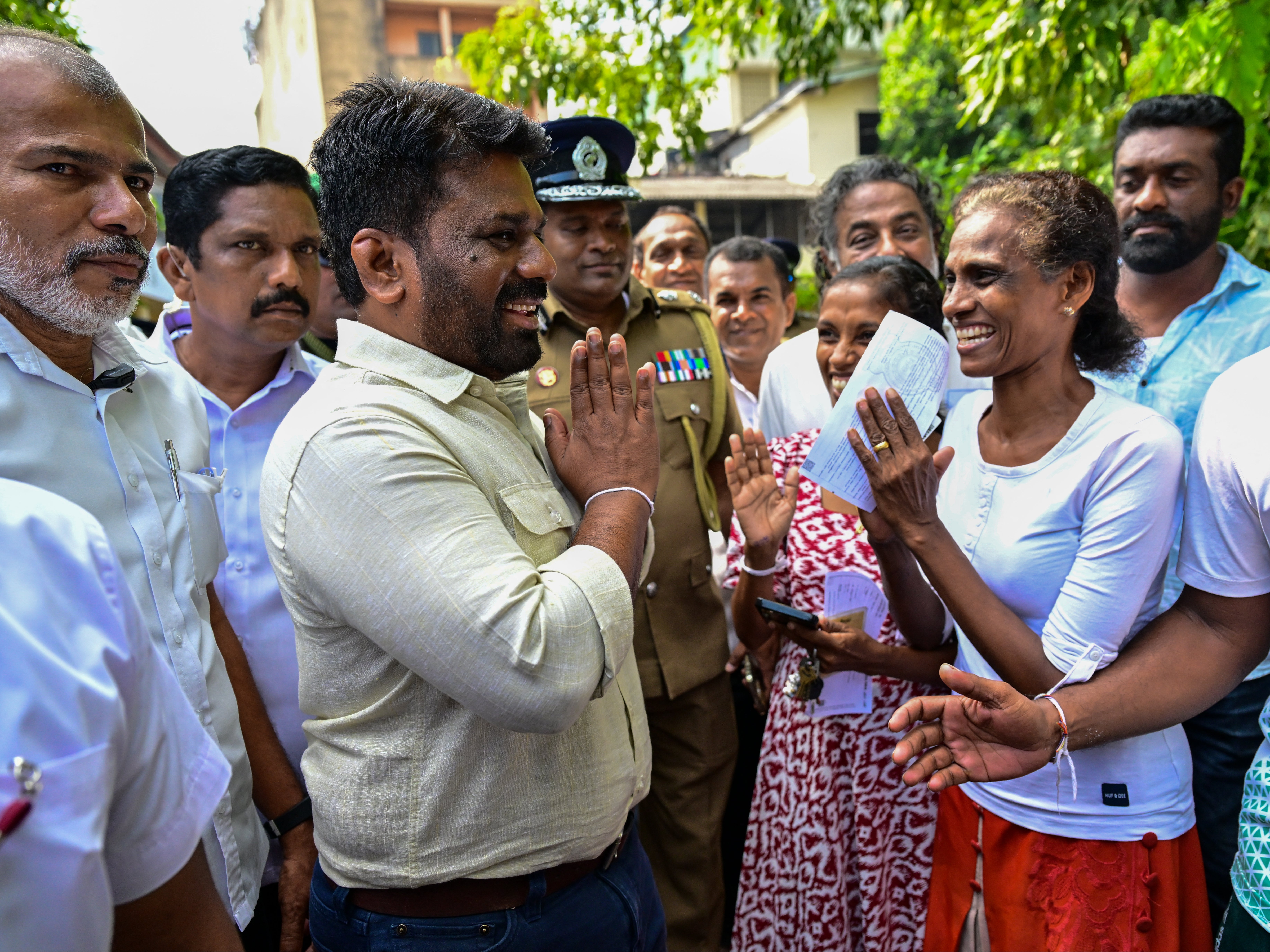 Sri Lankan president Anura Kumara Dissanayake leaves a polling station after casting his vote in the parliamentary election in Colombo on 14 November 2024