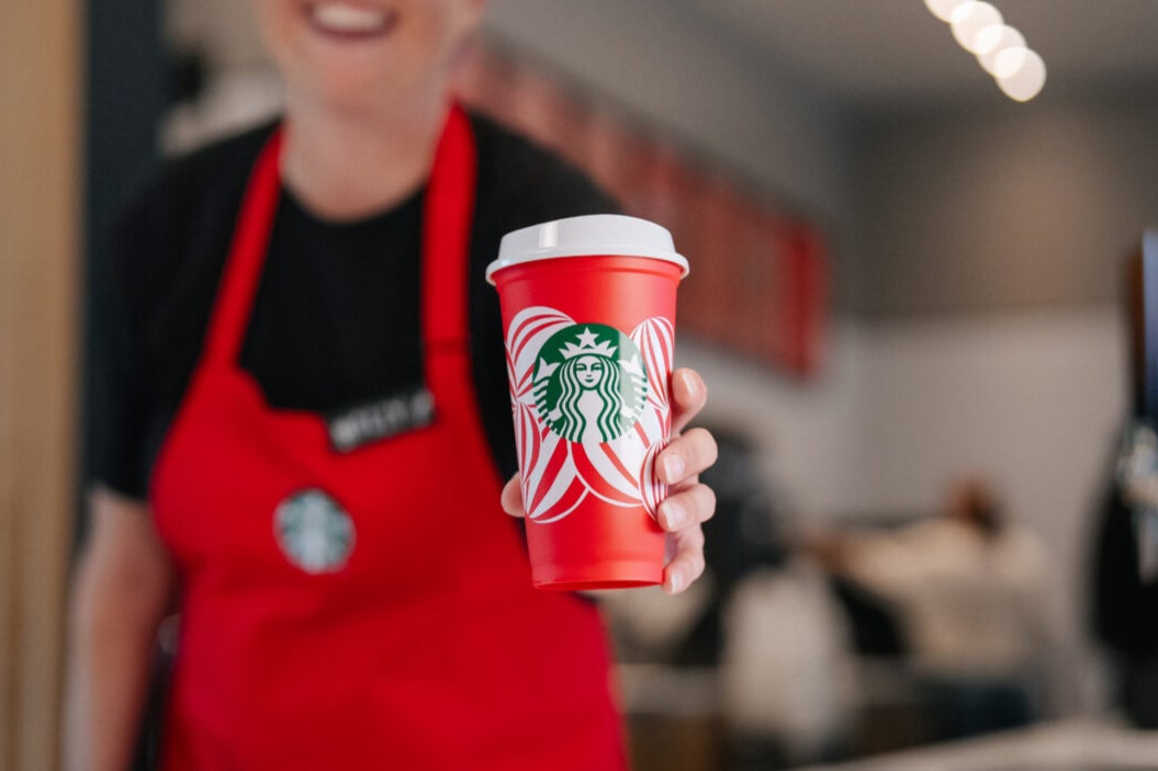 Customers can get a free Starbucks reusable red cup with select purchases