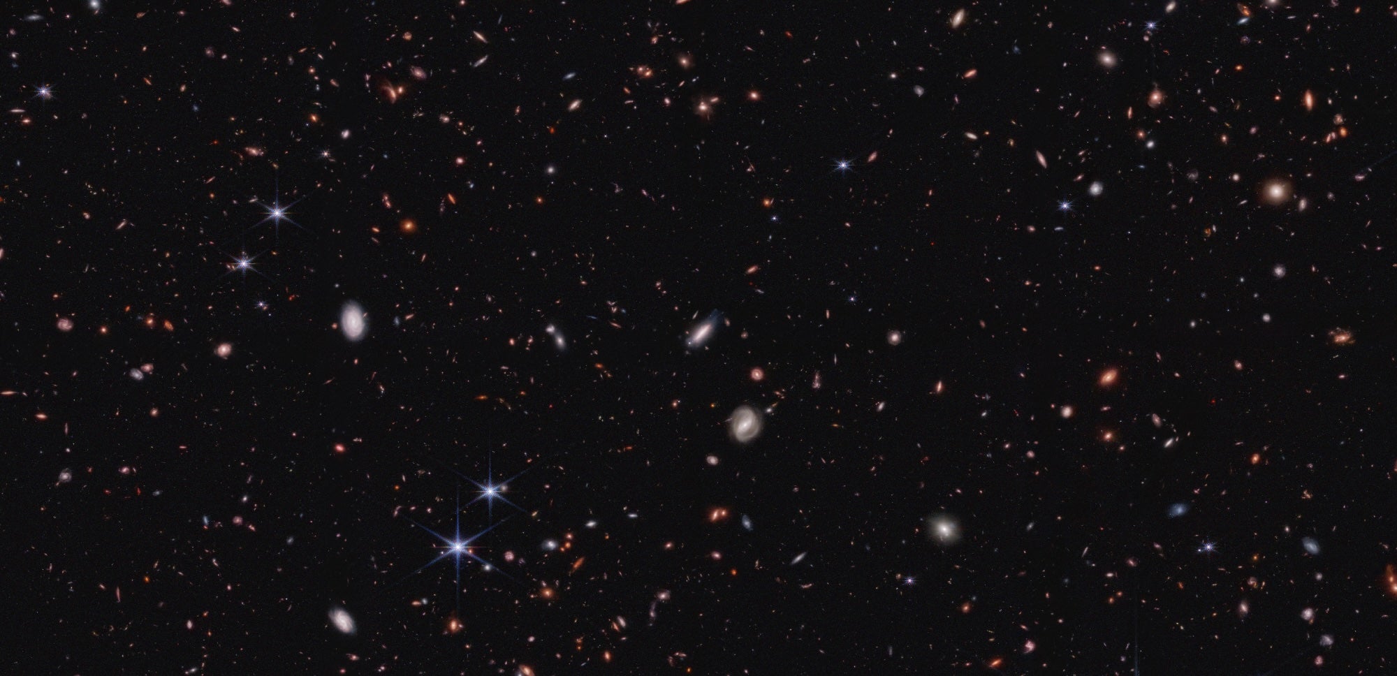 This image shows a small portion of the field observed by NASA’s James Webb Space Telescope’s Near-Infrared Camera for the Cosmic Evolution Early Release Science survey. It is filled with galaxies.