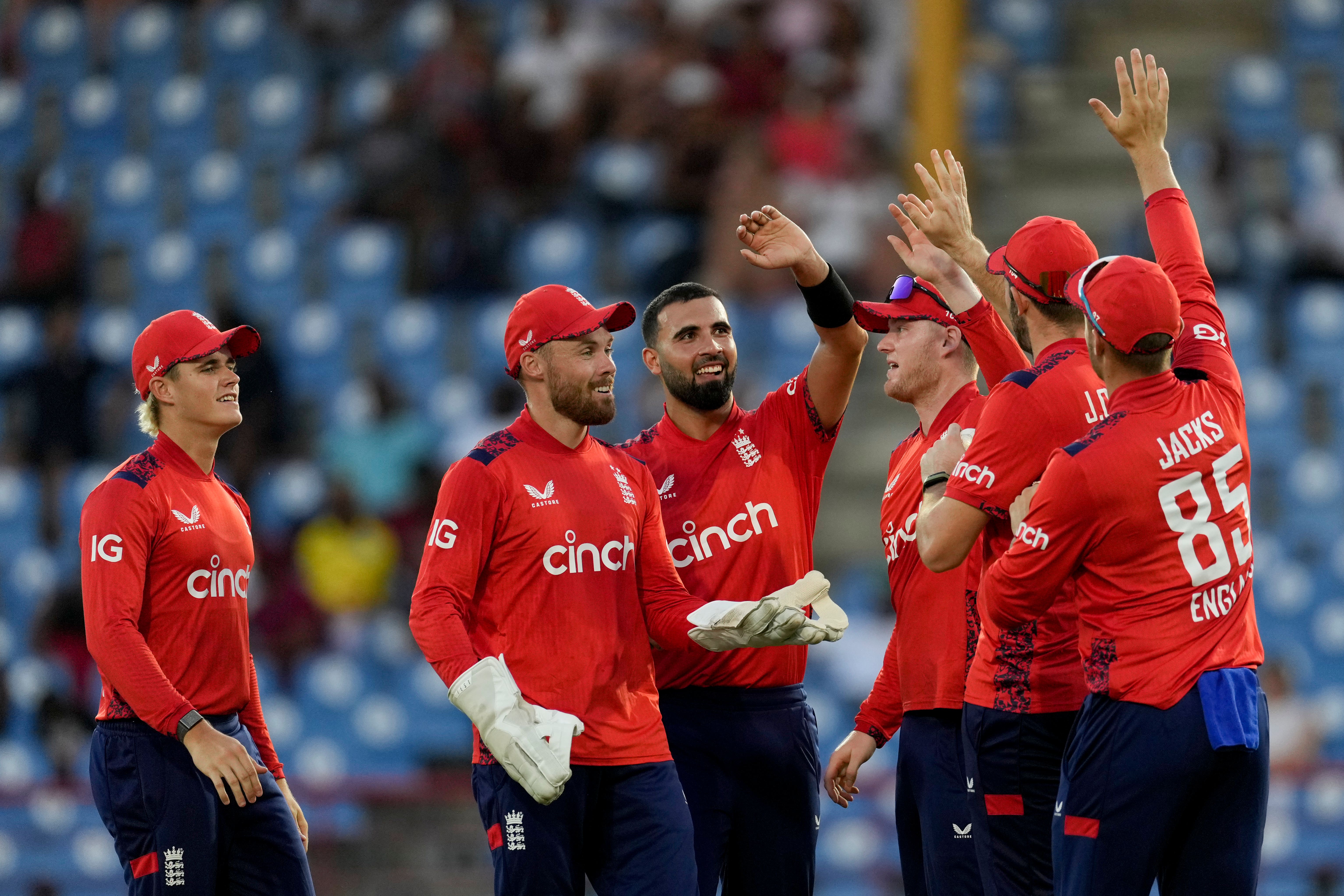 Saqib Mahmood, centre, inspired England to victory in St Lucia (Ricardo Mazalan/AP)