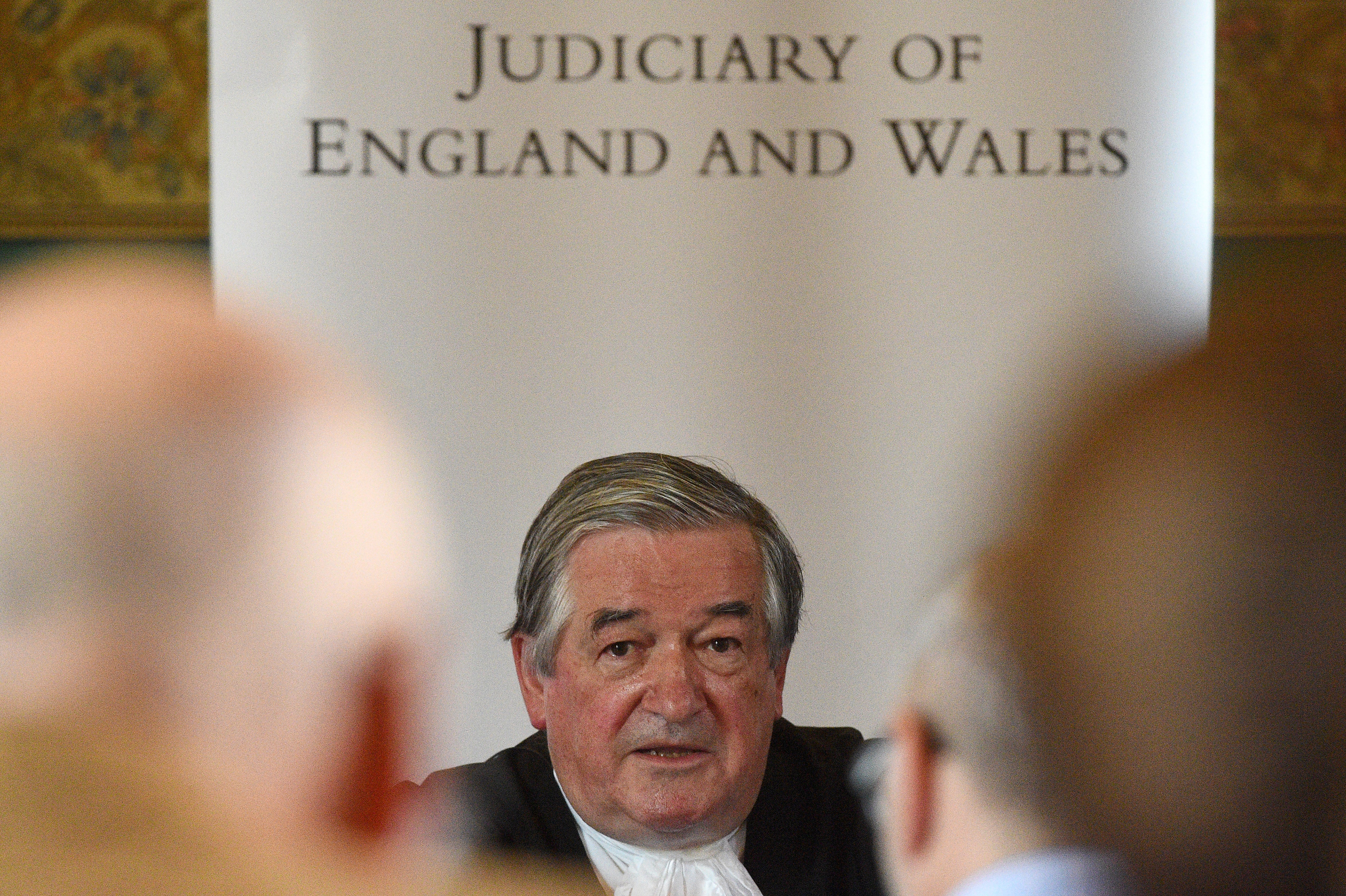 Sir James Munby, holds a press conference on the day of his retirement as President of the Family Division, at the Royal Courts of Justice in London.