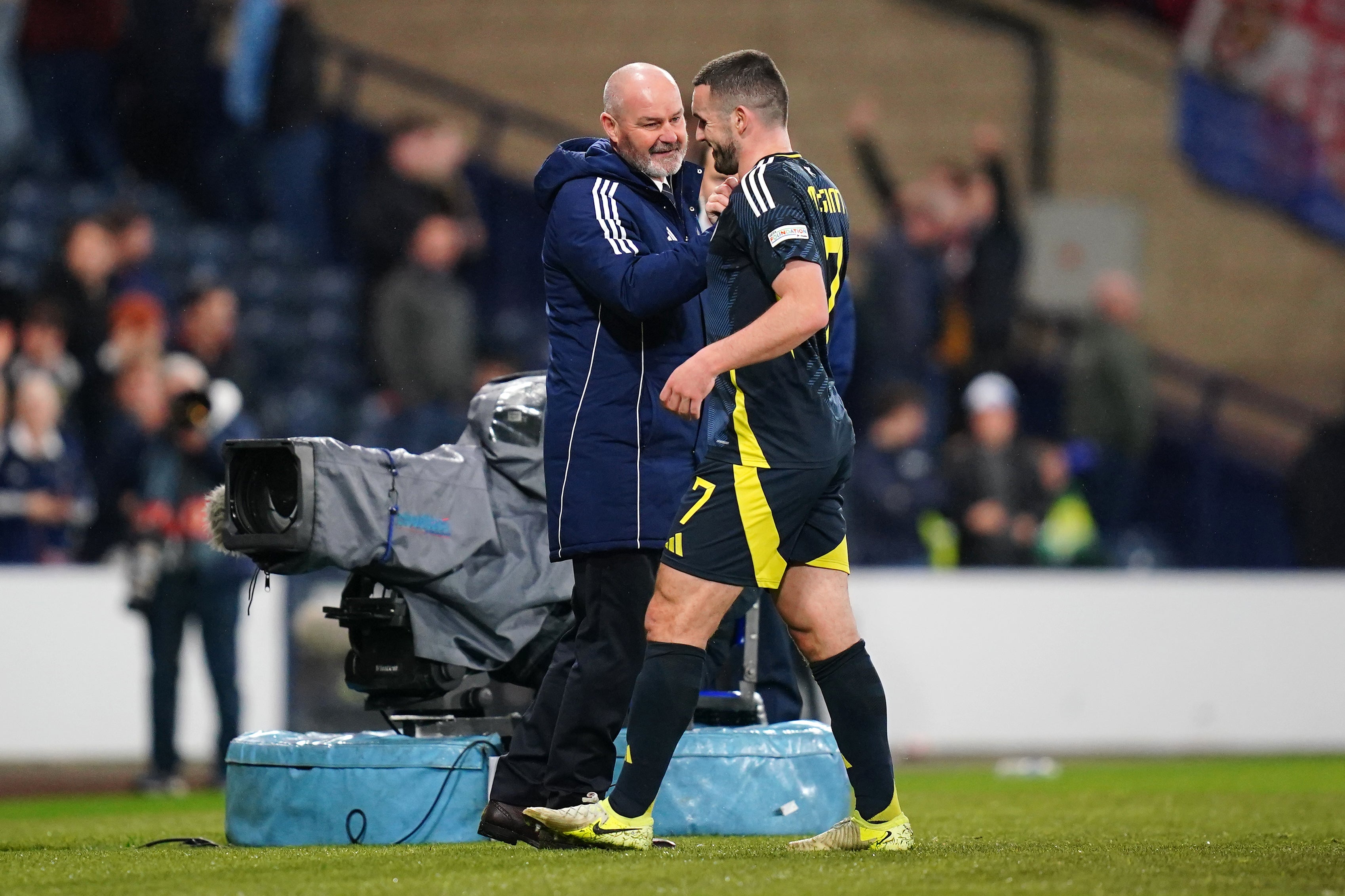 Scotland manager Steve Clarke, left, congratulates match-winner John McGinn (Jane Barlow/PA)