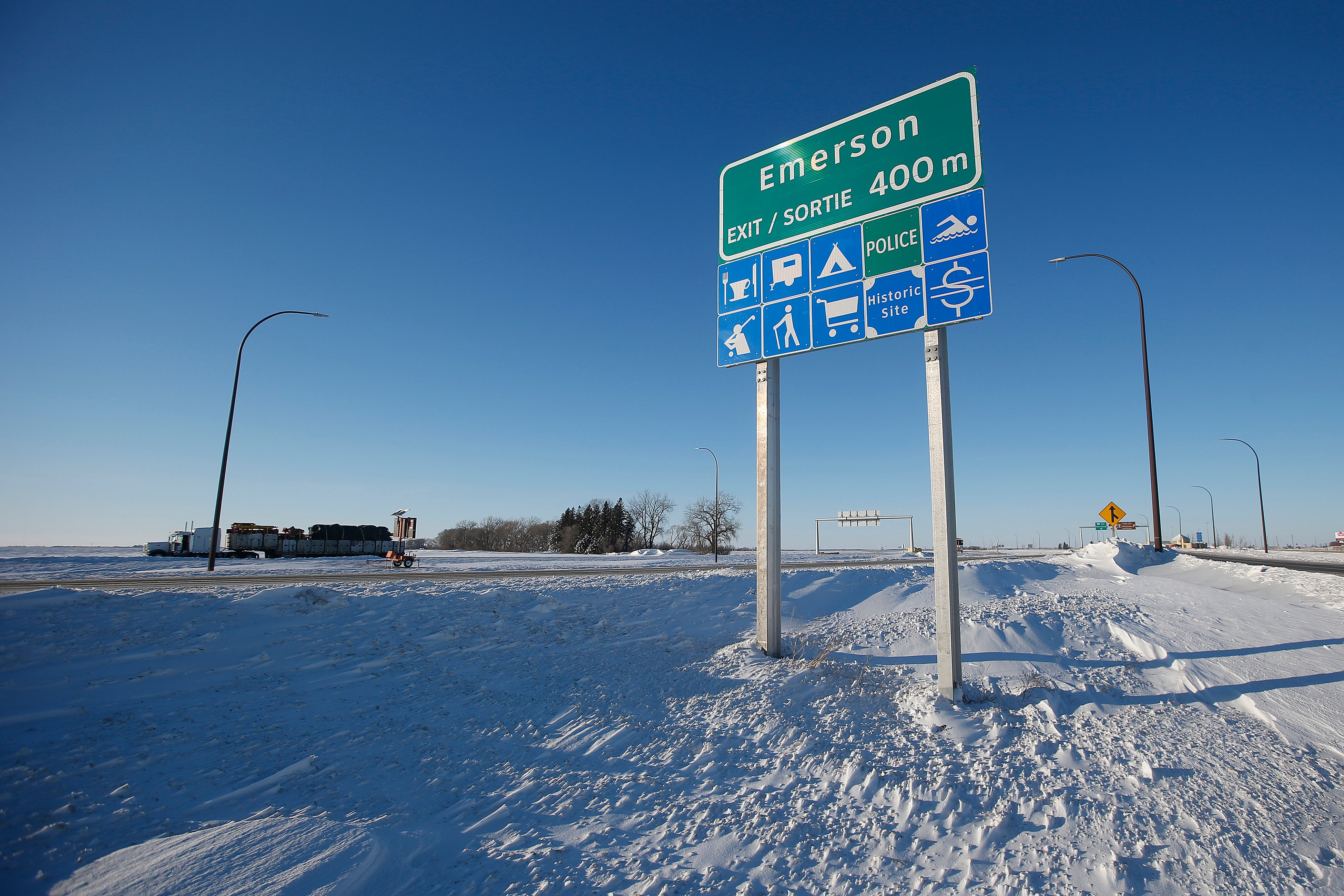 Road signage is posted just outside of Emerson, Manitoba on Thursday