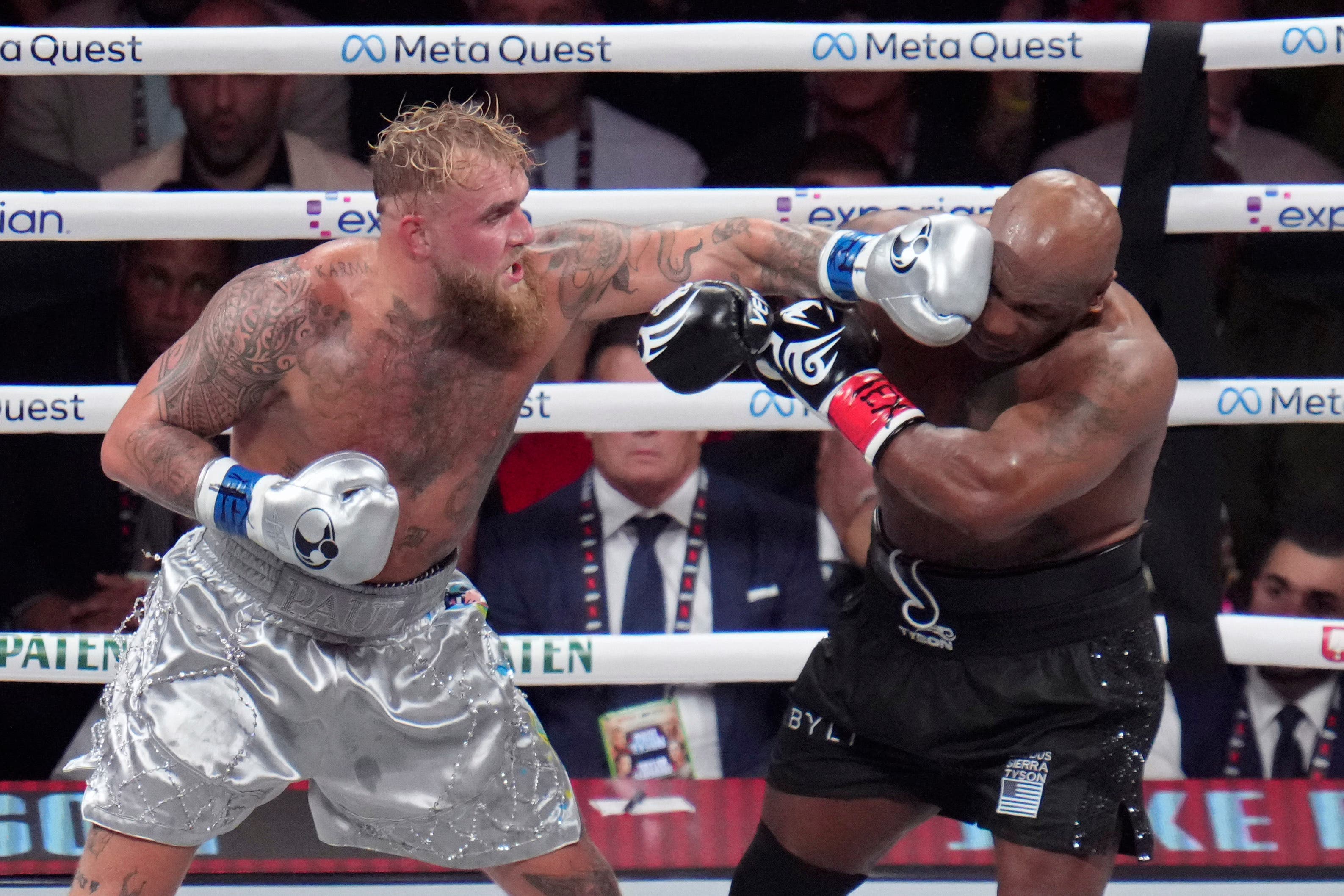 Jake Paul (left) admitted to pulling his punches against Mike Tyson