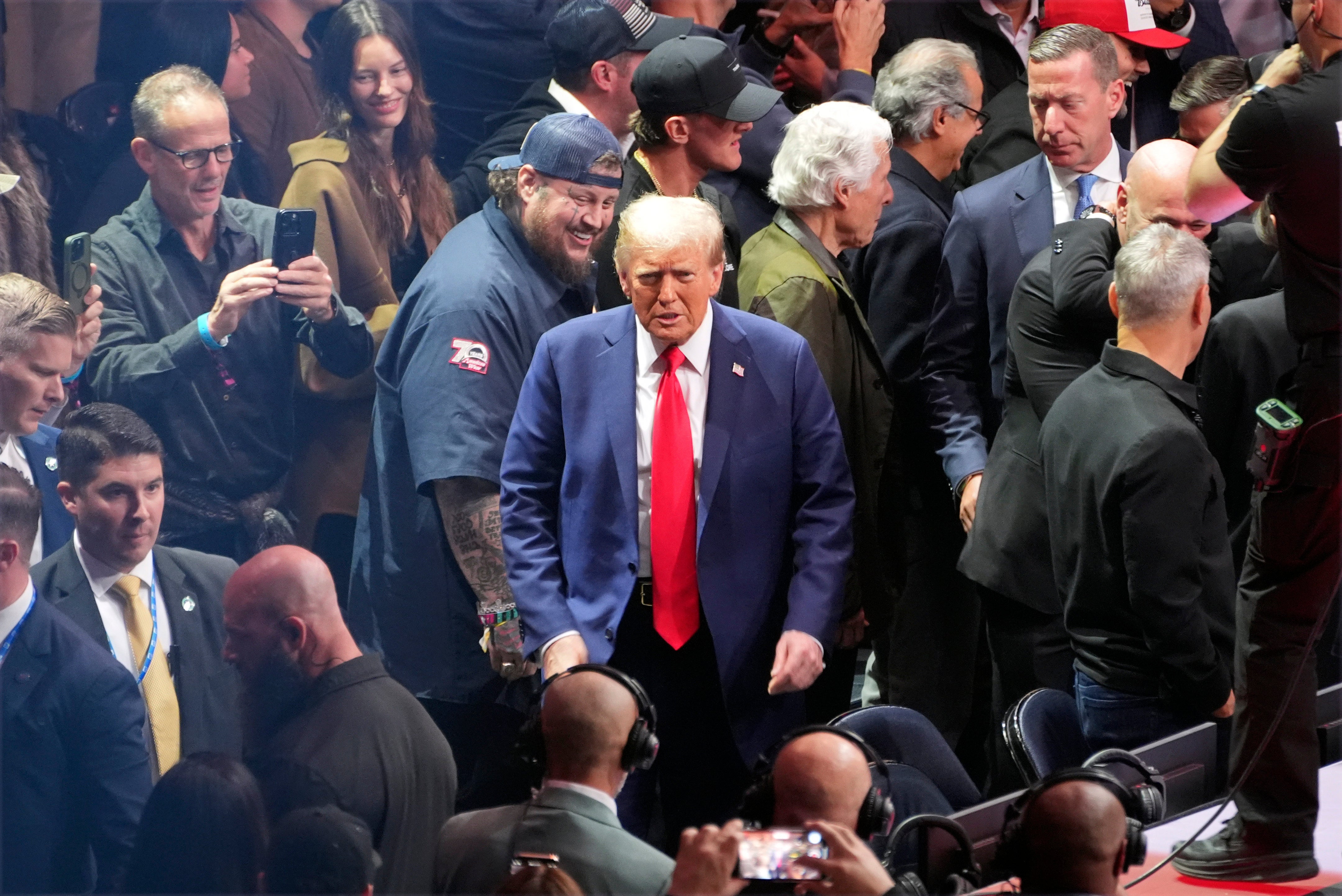 Donald Trump walks through the crowd at UFC 309 in Madison Square Garden on Saturday night