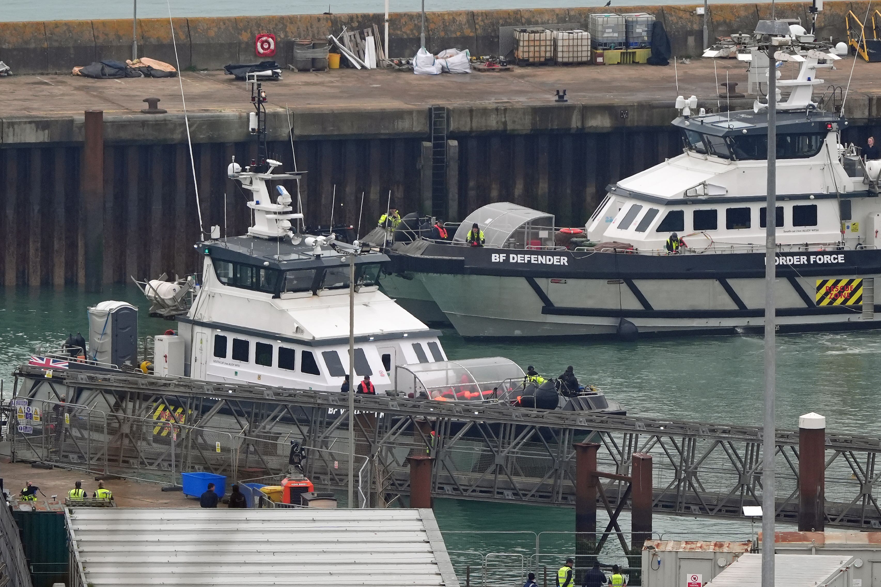 A group of people thought to be migrants are brought in to Dover, Kent, onboard a Border Force vessel following a small boat incident in the Channel (Gareth Fuller/PA)
