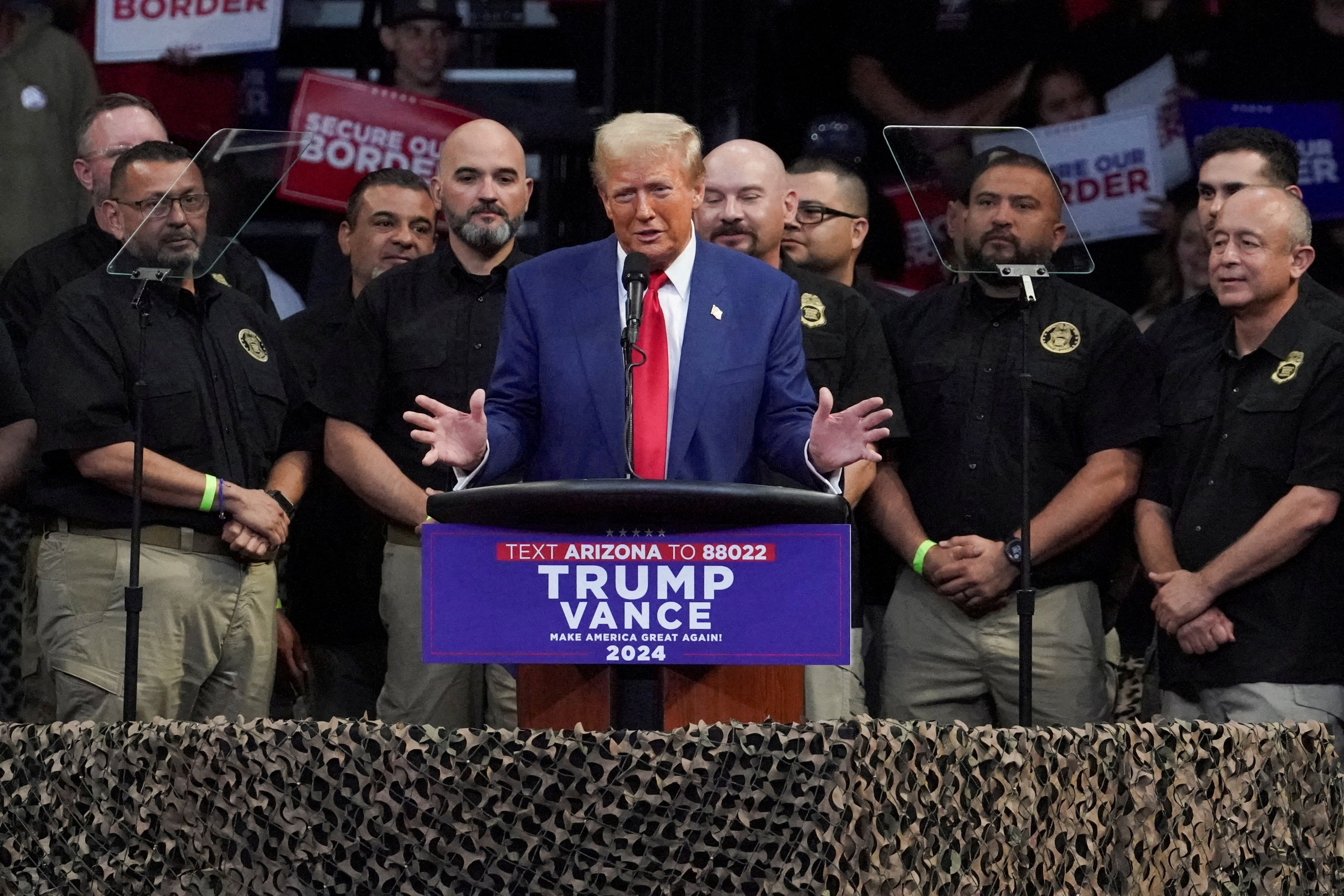 Donald Trump speaks in front of border patrol agents on the campaign trail, where he pledged a ‘mass deportation operation’ that could upend millions of families