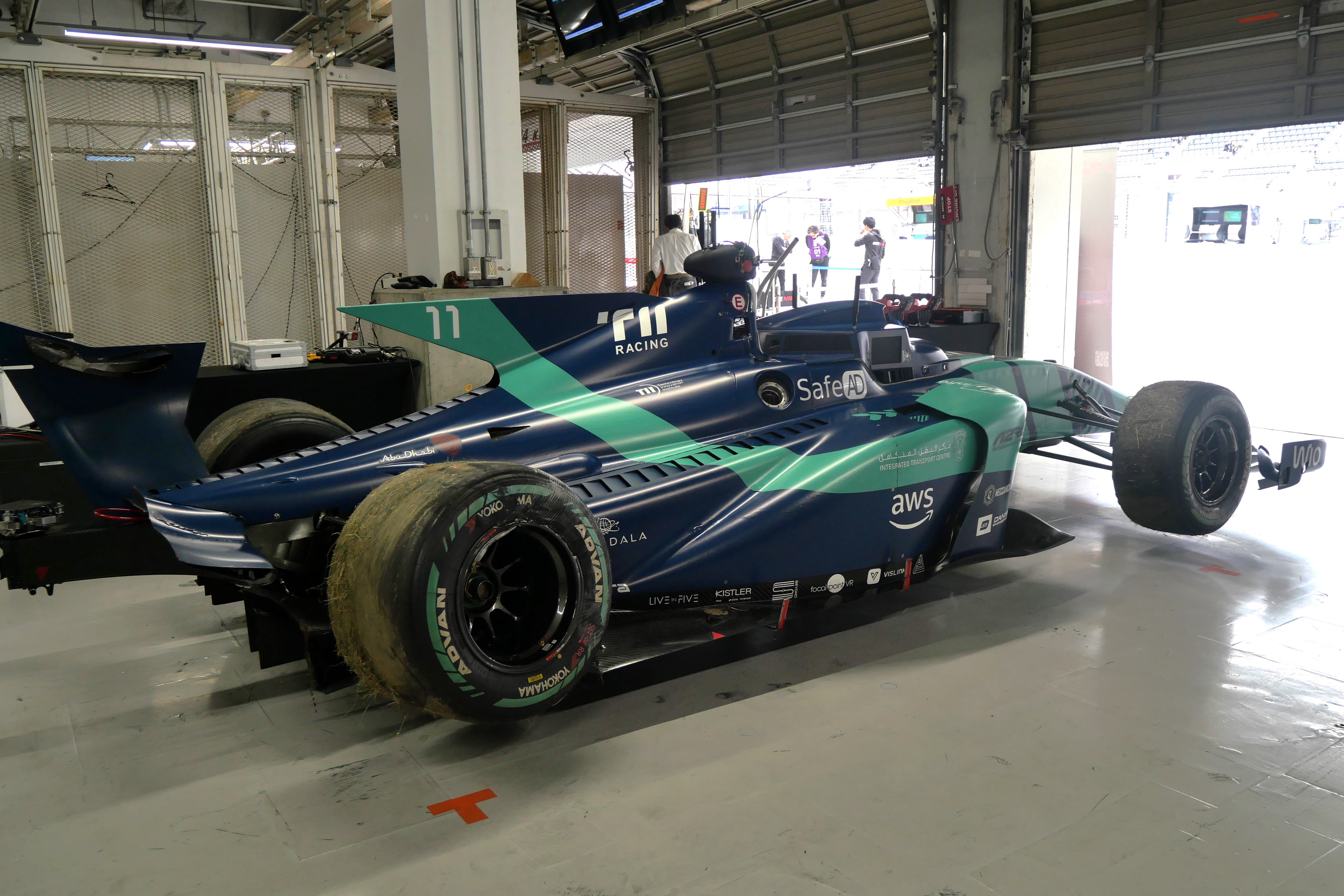 The stricken AI car, developed by the Technology Innovation Institute (TII) team from the United Arab Emirates (UAE), back in the garage following the pre-race crash on 10 November, 2024