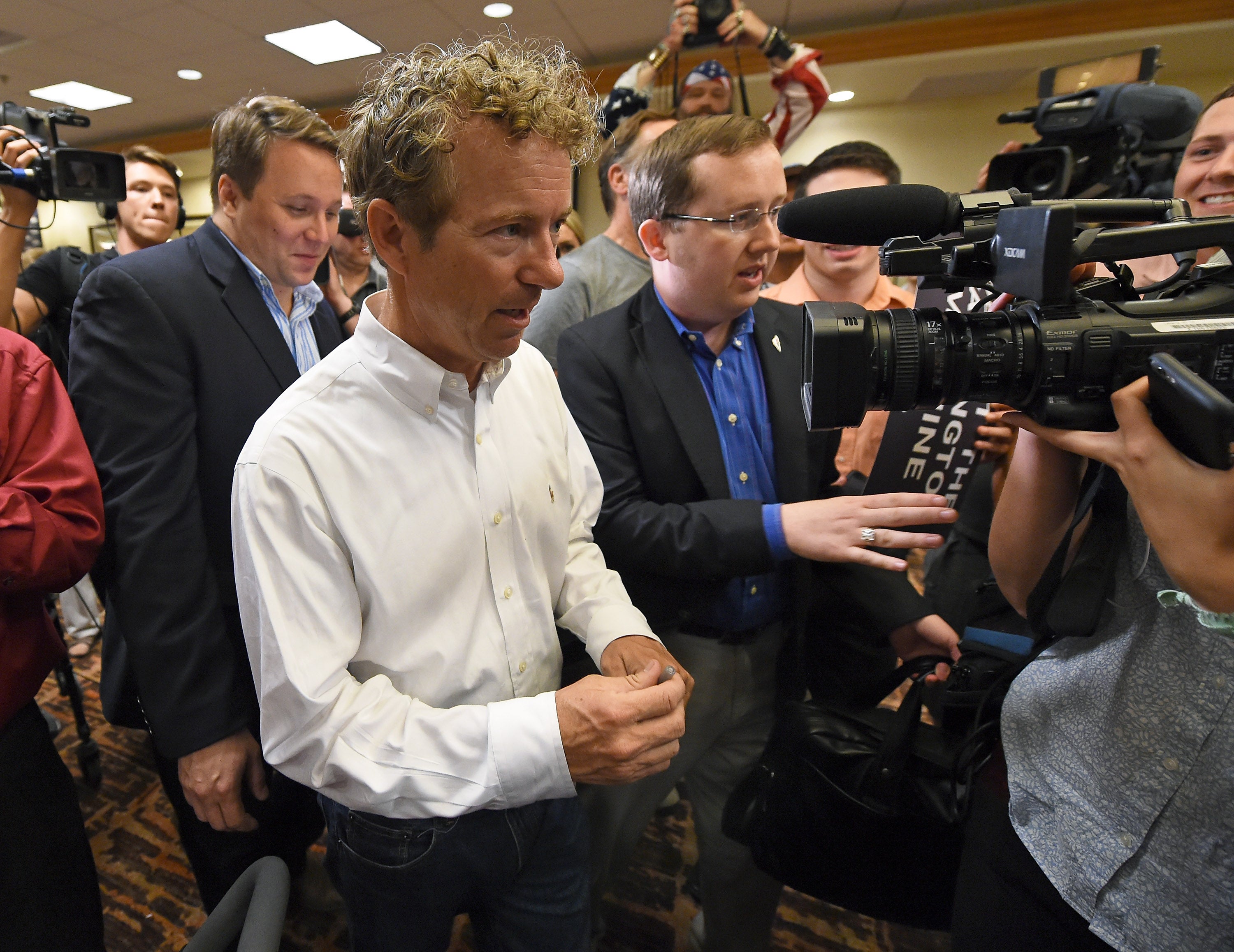 Sergio Gor (center-right) has worked for a host of right-wing pols, including Sen. Rand Paul (center-left)