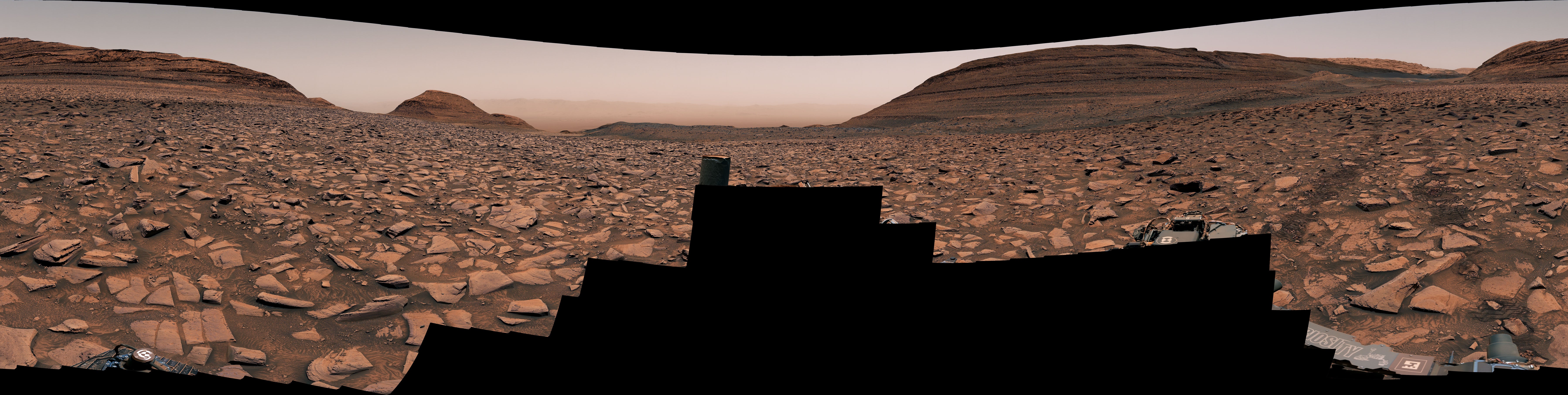 Curiosity captured this panorama using its Mastcam instrument. The rover’s tracks are visible on the image’s righthand side