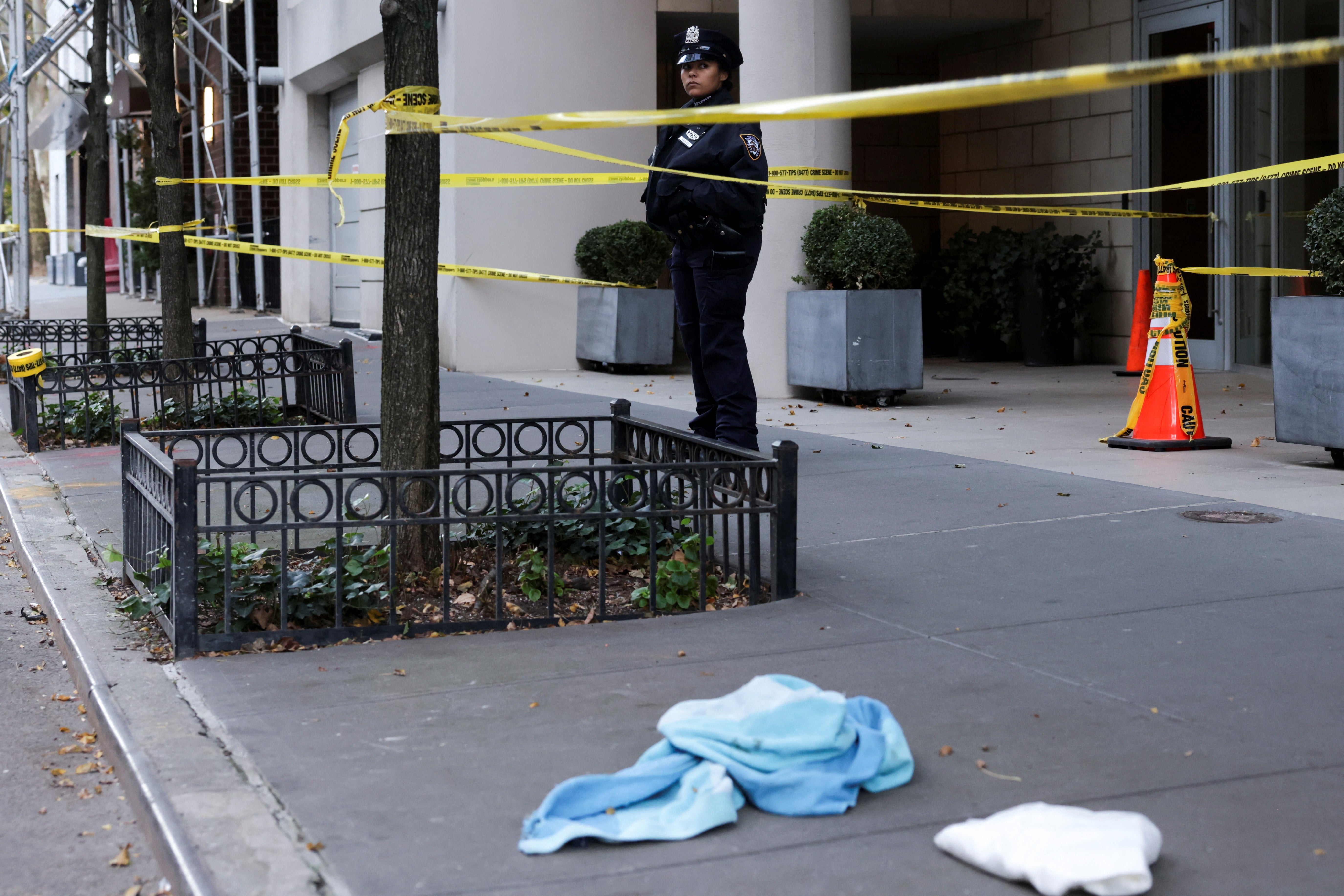 A police officer at the scene of the first stabbing attack