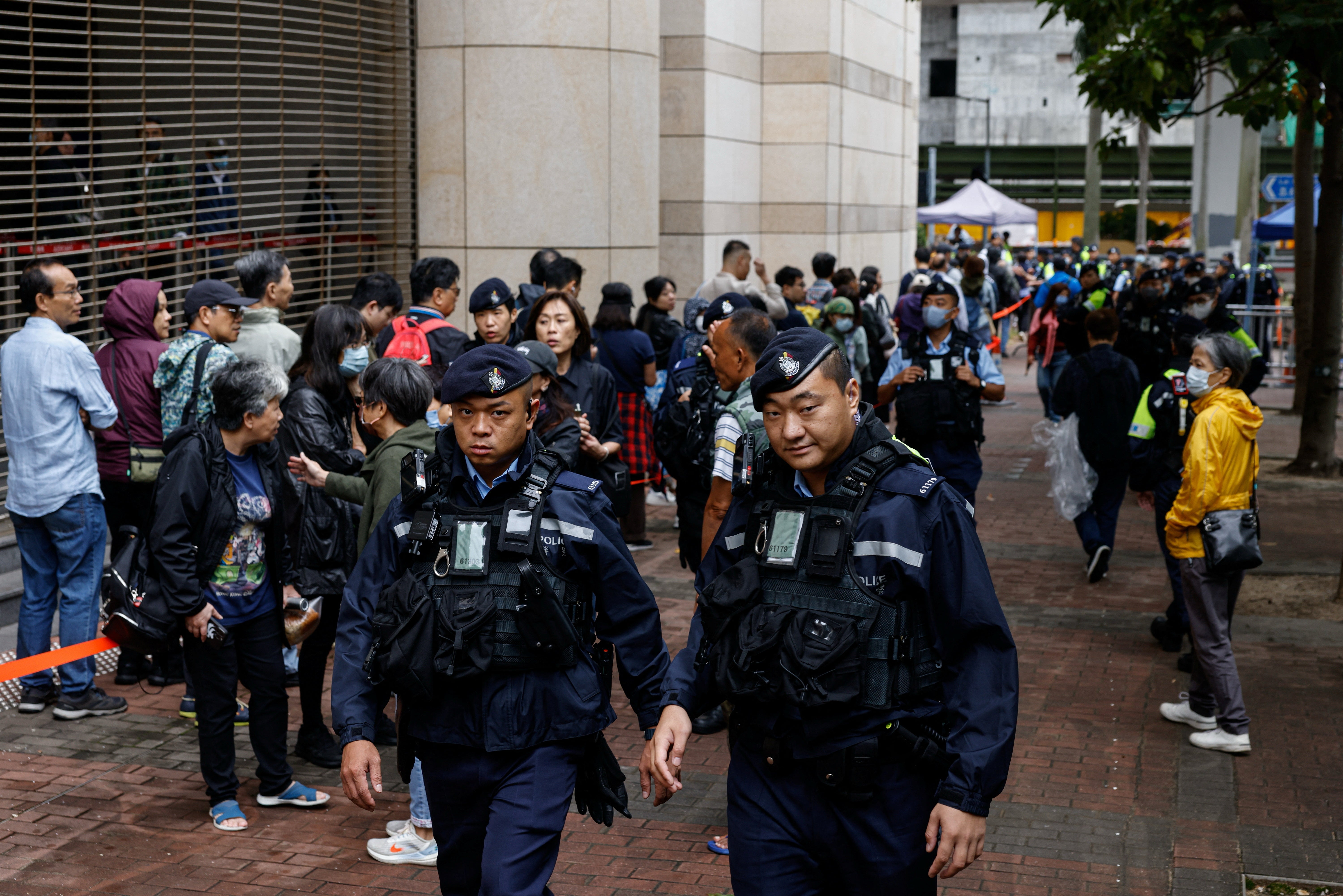 Police patrol outside the Hong Kong High Court ahead of sentencing in the national security case on 19 November 2024