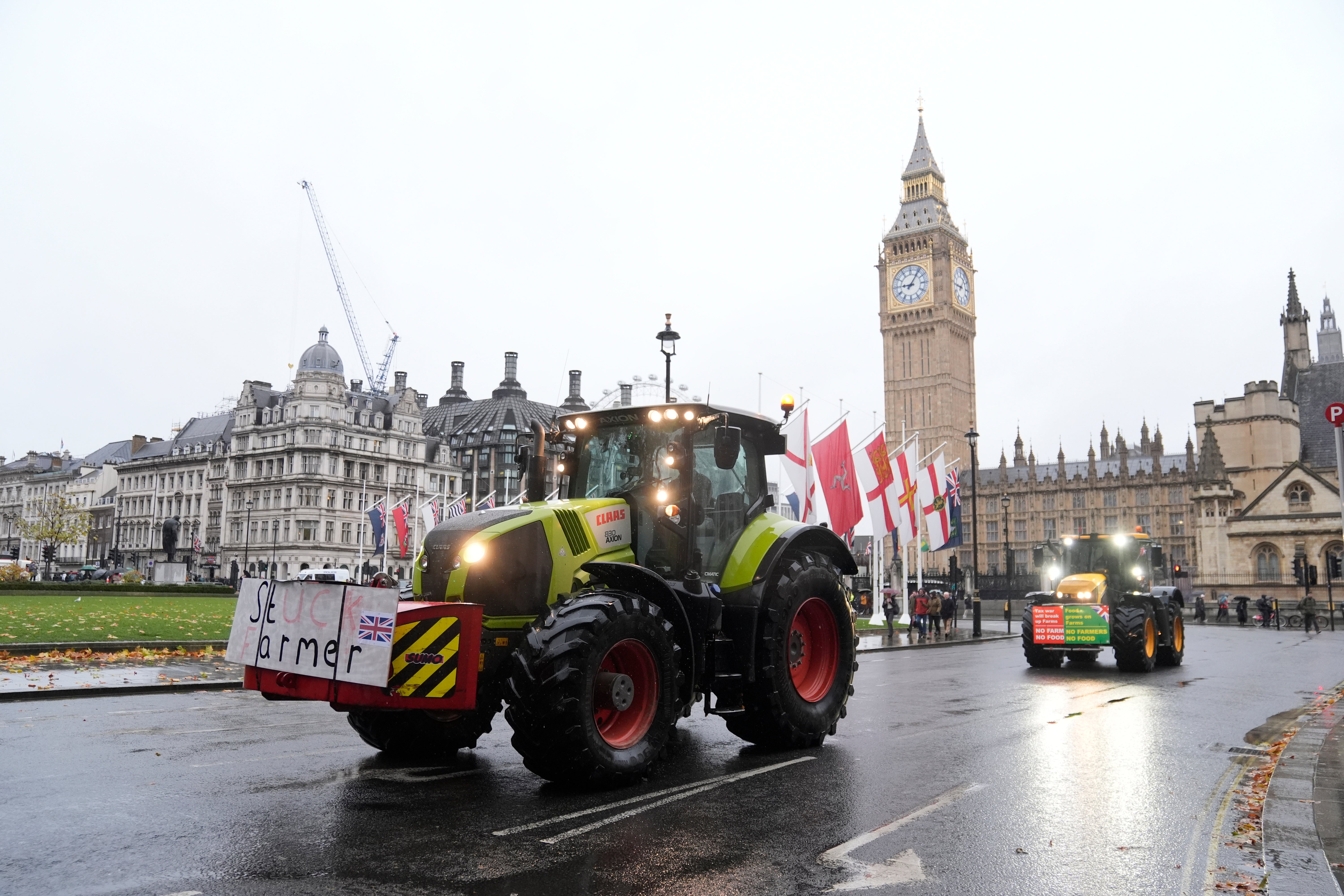 Farmers in tractors drive in Parliament Square ahead of a protest in central London