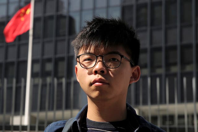 <p>Joshua Wong stands outside the Legislative Council building in Hong Kong on 28 November 2019</p>