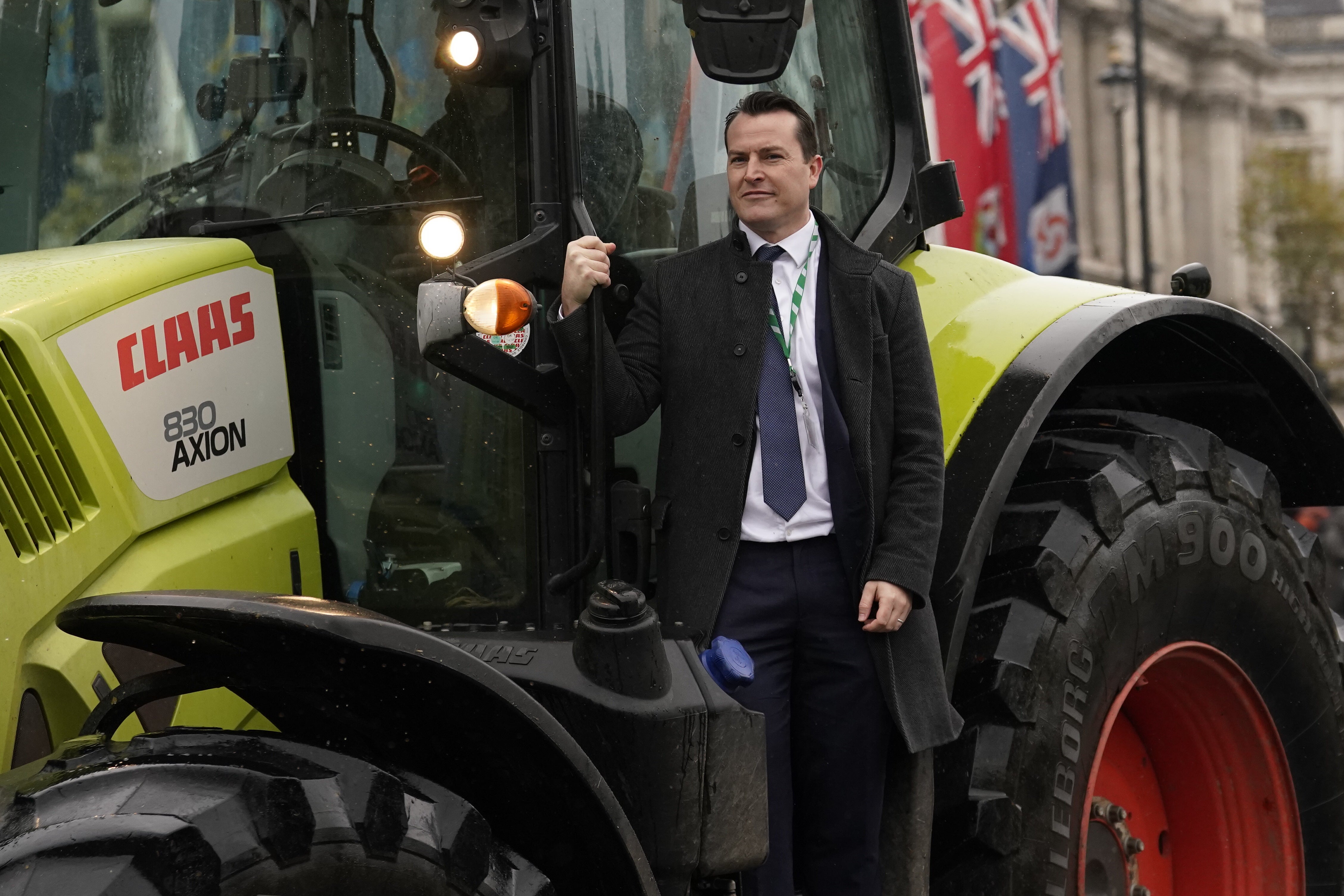 Reform MP James McMurdock rides on a tractor