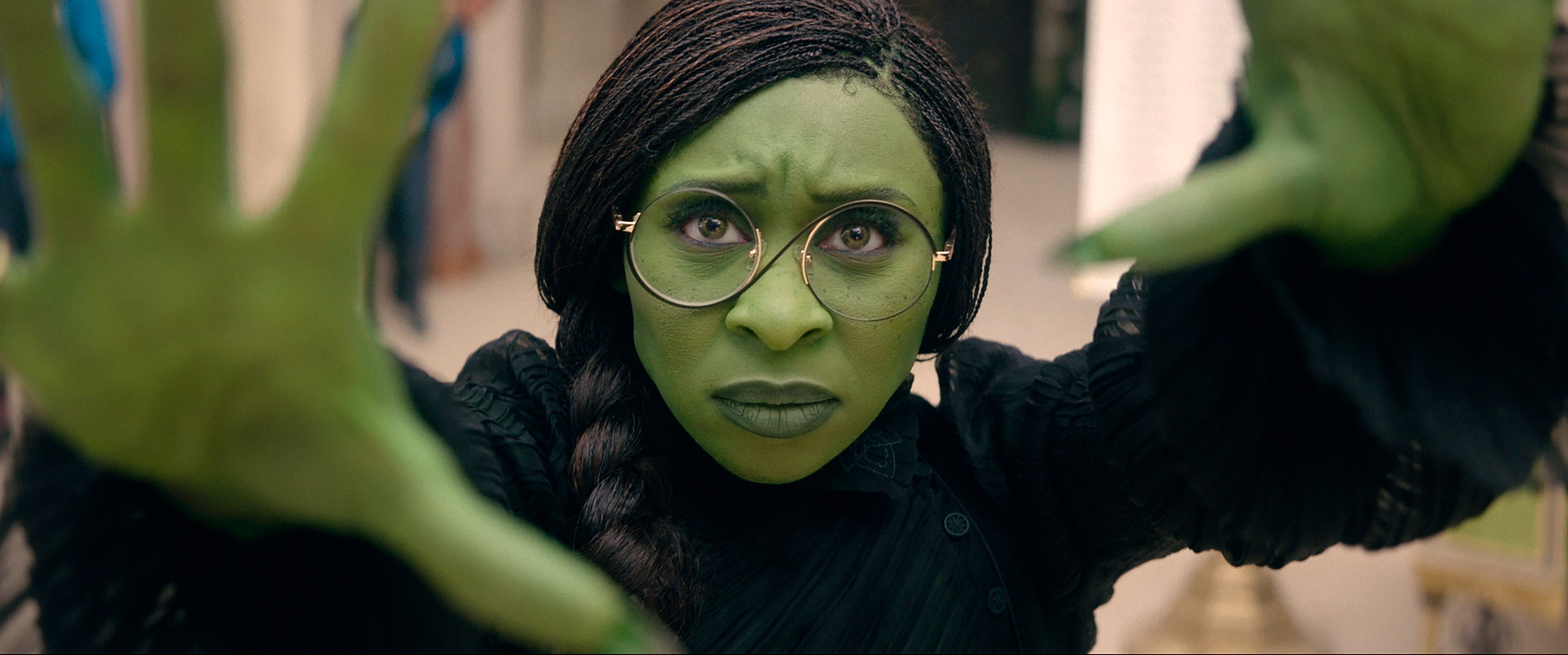 Elphaba’s skin is green because her mother drank a green elixir while pregnant