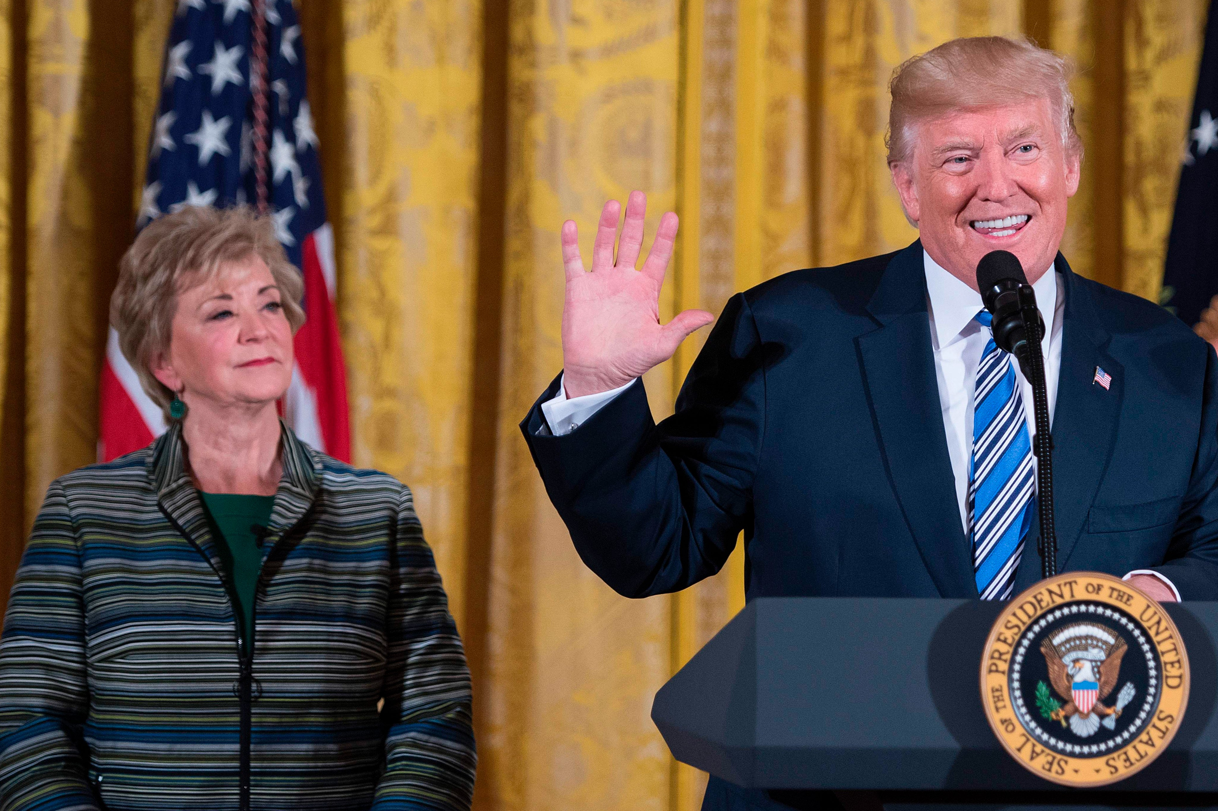 Donald Trump speaks with SBA Administrator Linda McMahon during an event at the White House in Washington, D.C., on August 1, 2017. McMahon is expected to be named education secretary in the second Trump administration