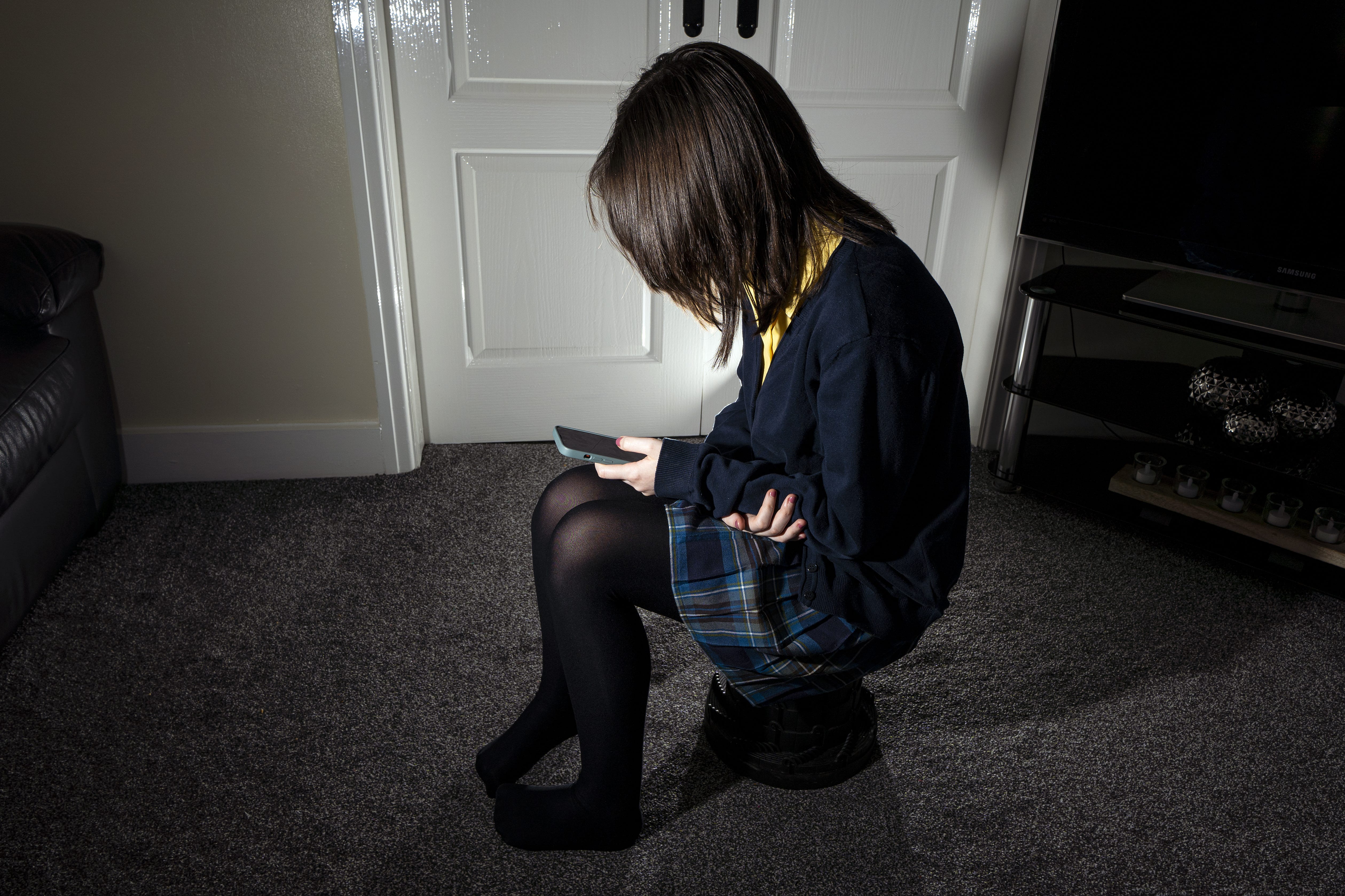 POSED BY MODEL Undated file photo of a young girl using a mobile phone. A new report warns that children’s mental health is at risk due to poor access to services. PA.