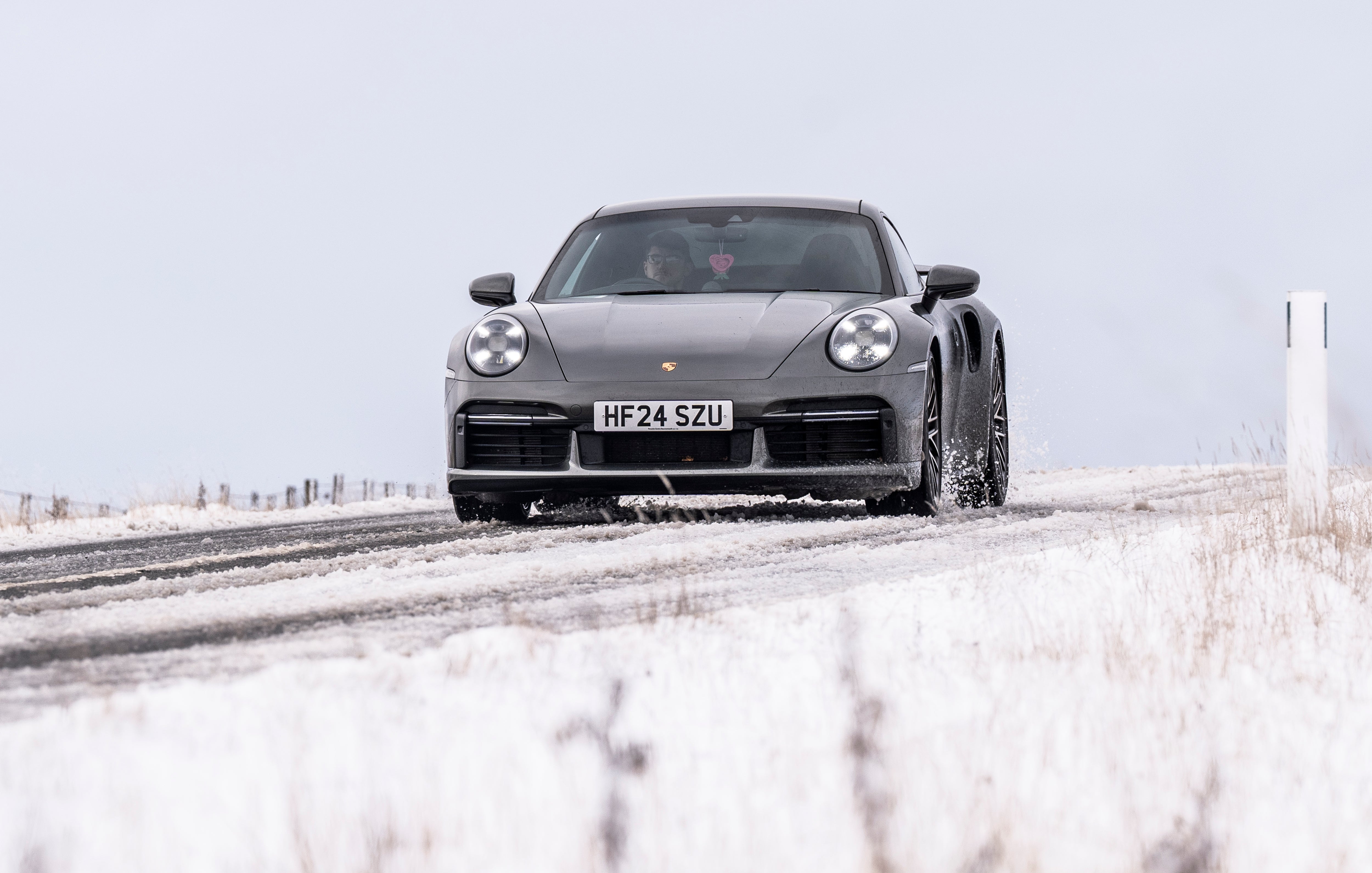 A car navigates the A57 Snake Pass in the Peak District, Derbyshire