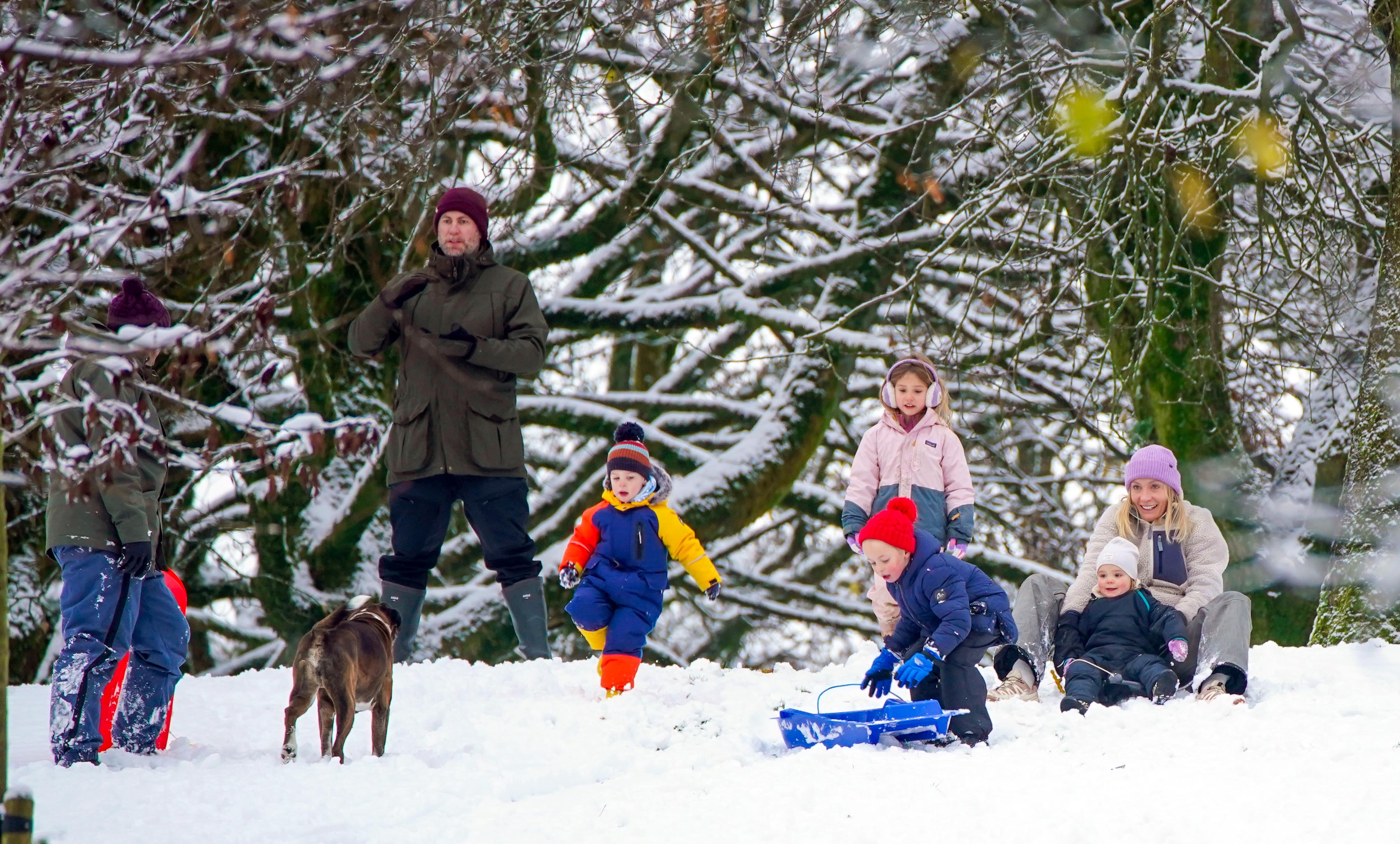 People play in the snow on the hills of Buxton, Derbyshire