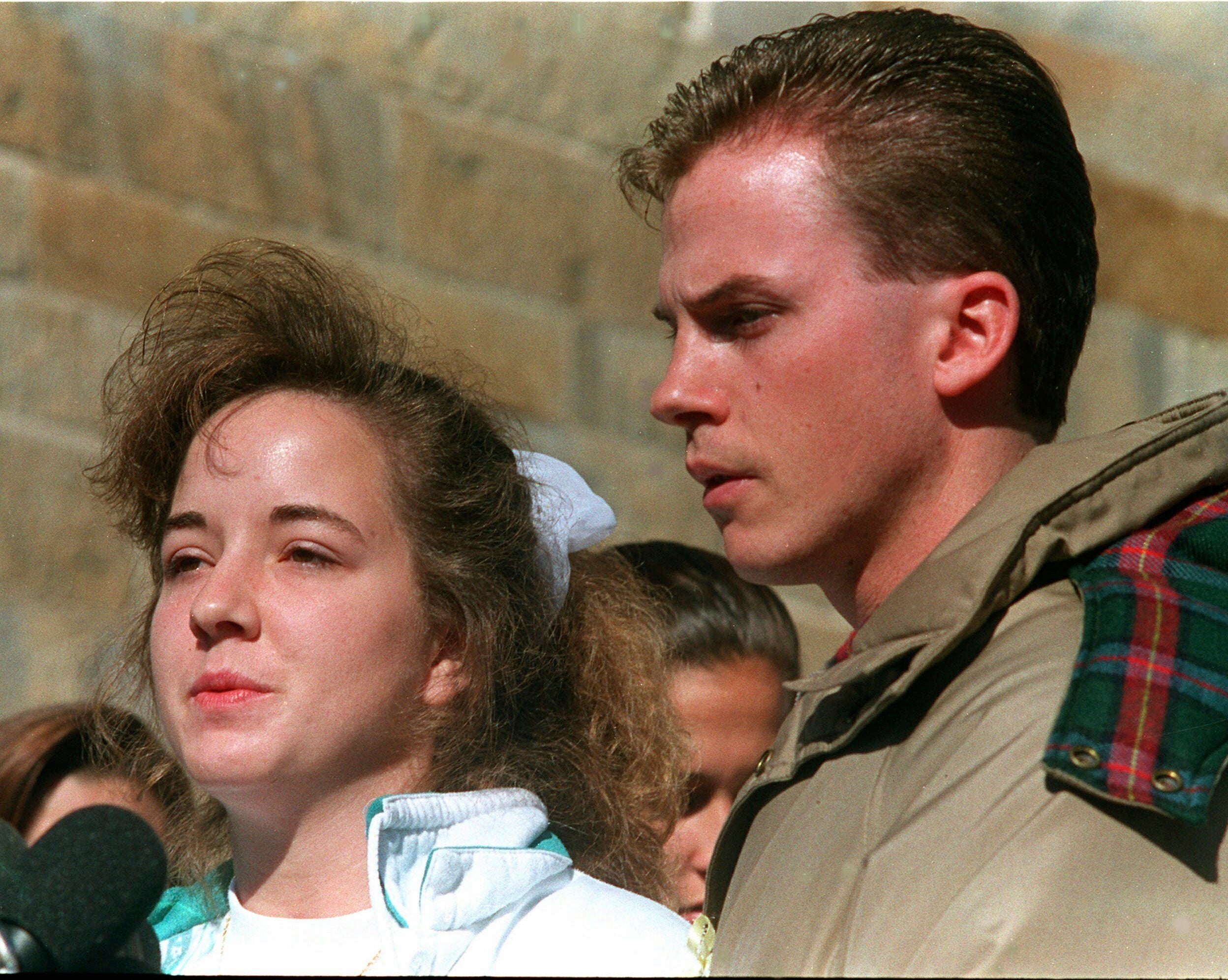 Susan and David Smith address reporters in 1994