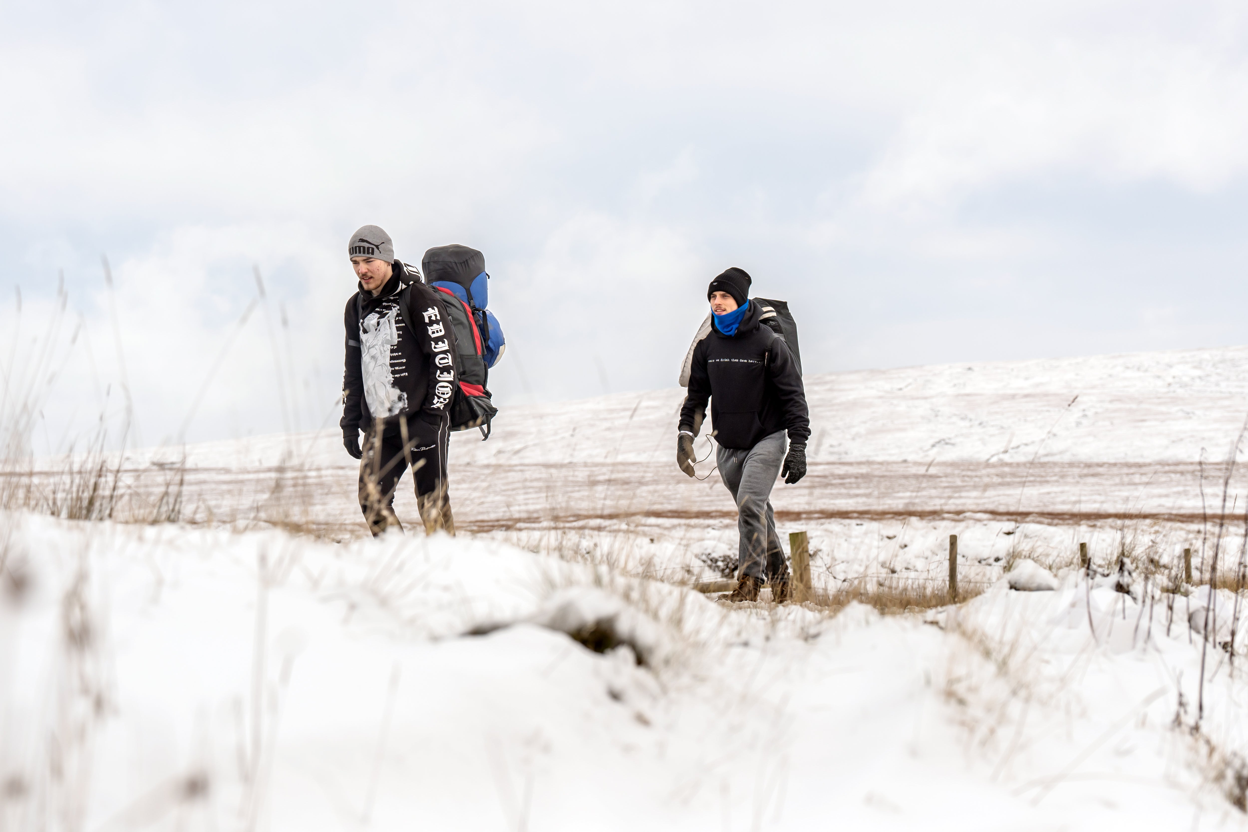 People walk near the A57 Snake Pass in the Peak District, Derbyshire