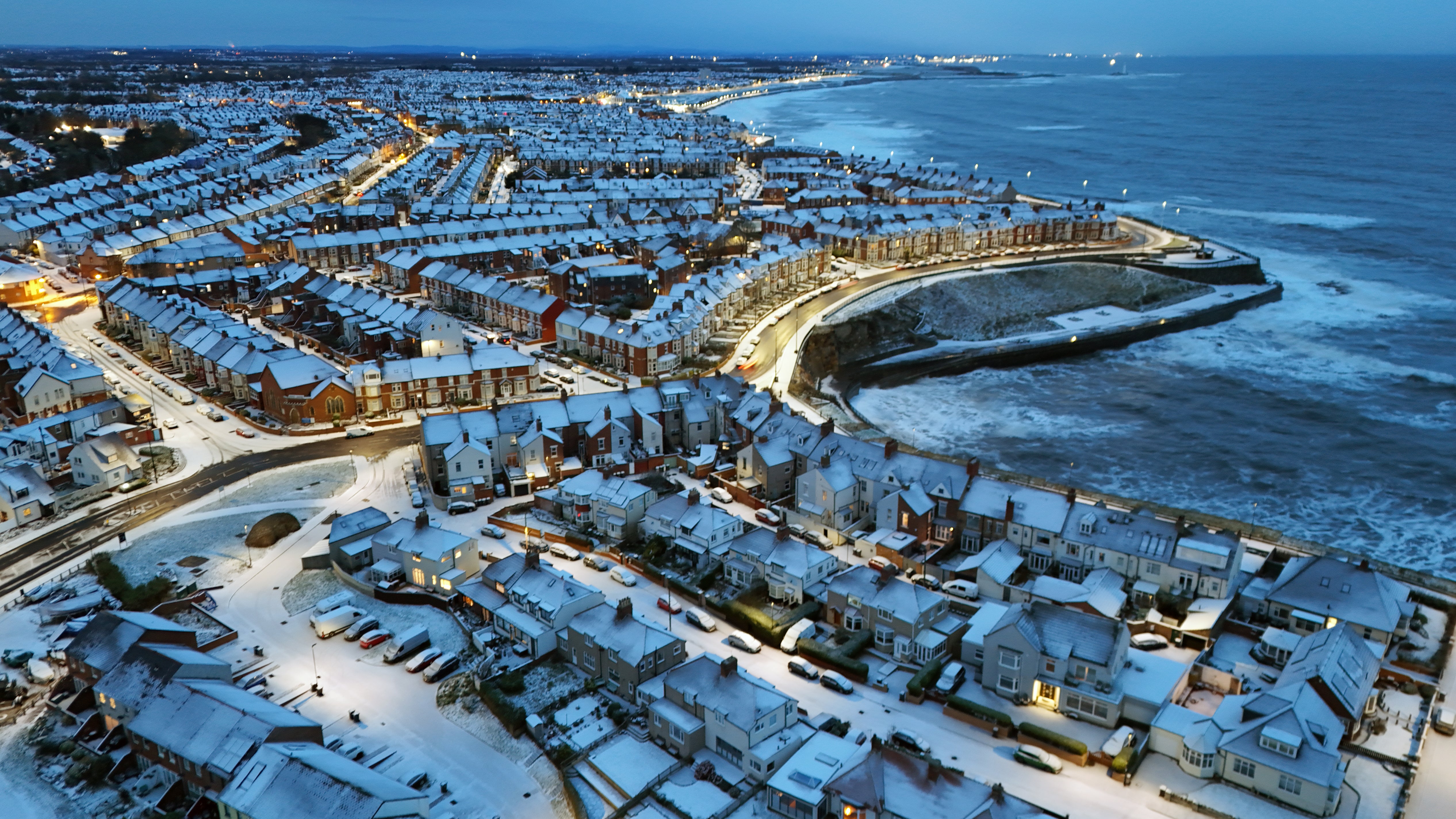 Overnight snow covers Cullercoats Bay in North Tyneside