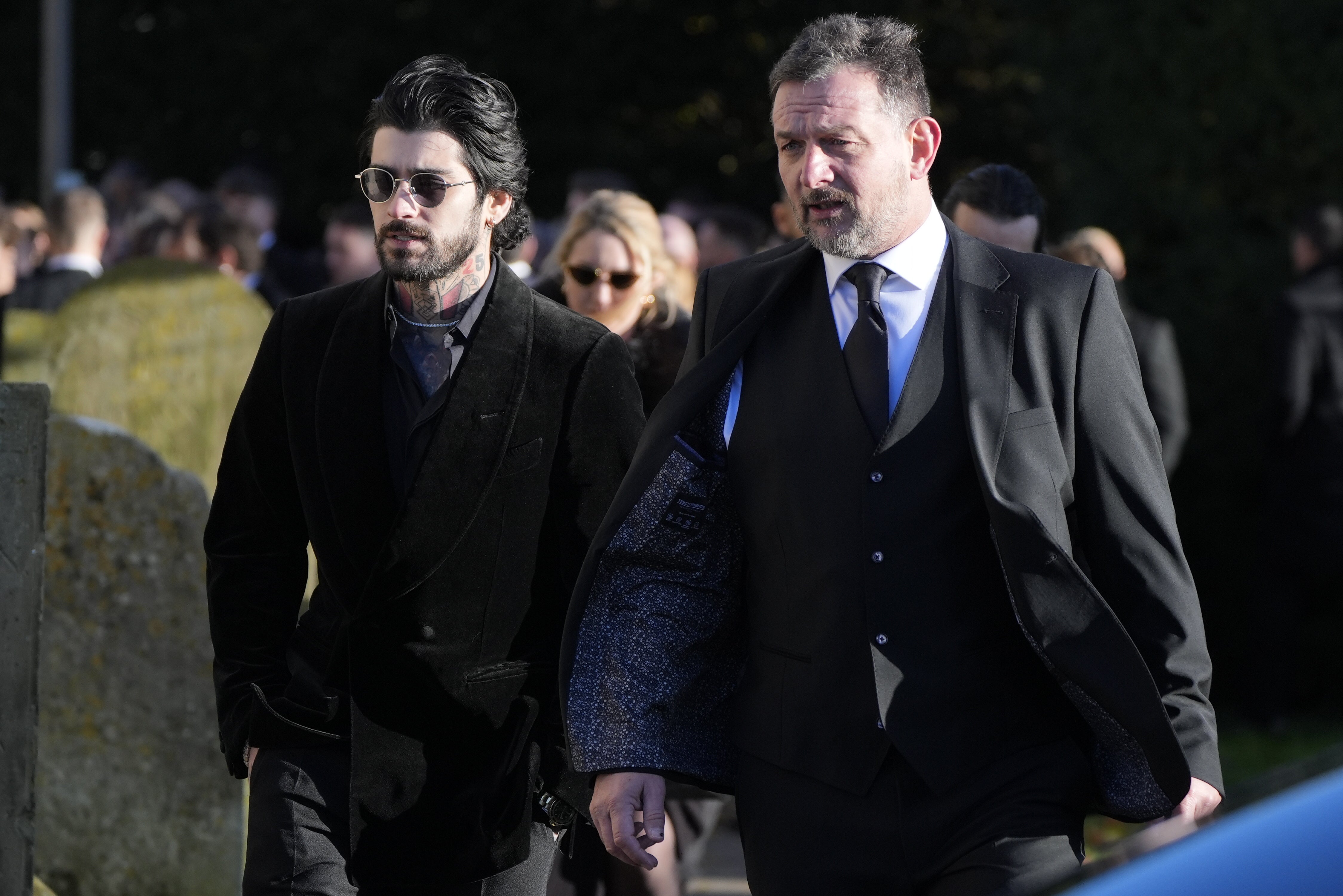 Zayn Malik (left) leaving Payne’s funeral