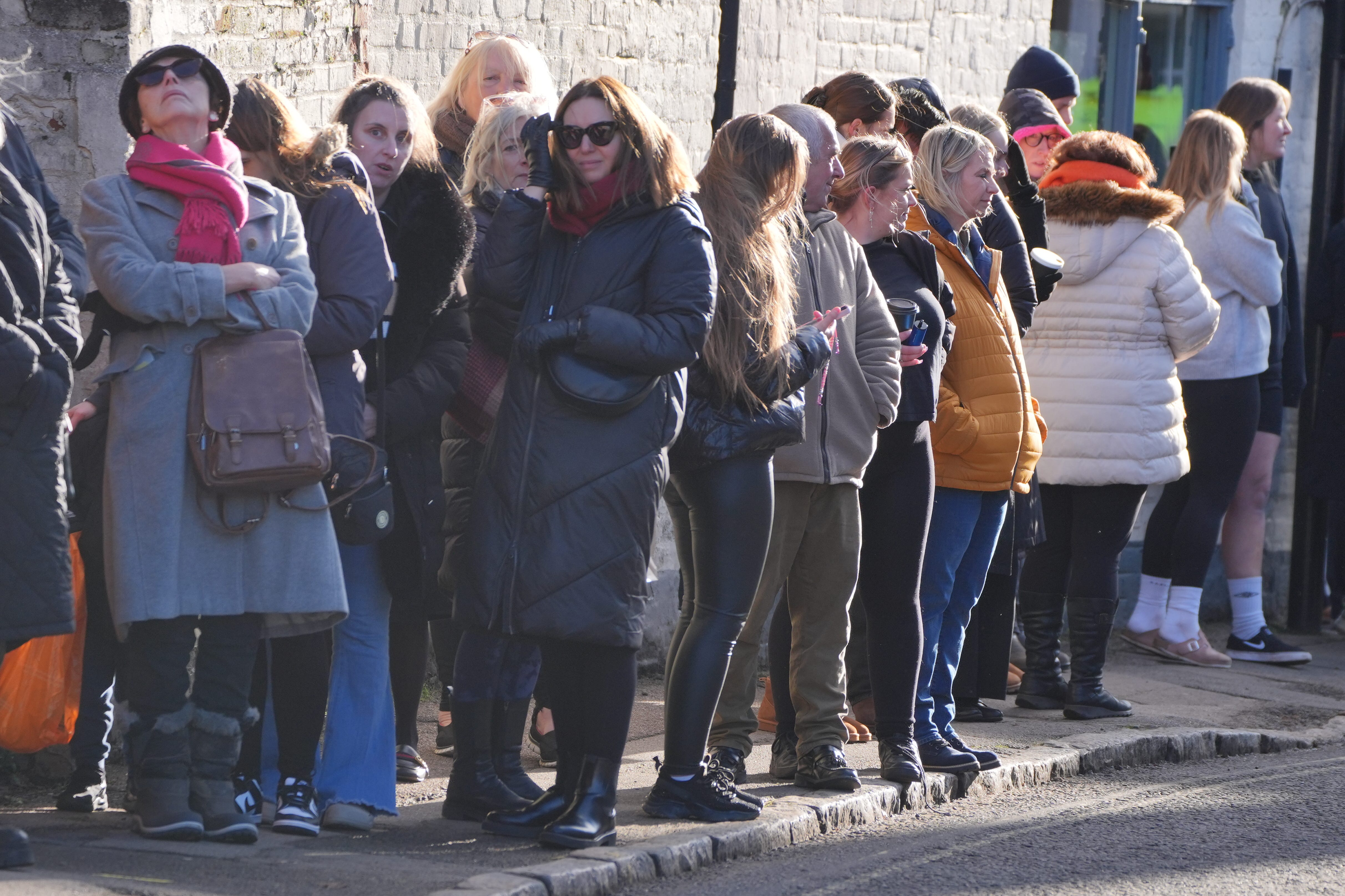 Members of the public line the route to the funeral service (Jonathan Brady/PA)