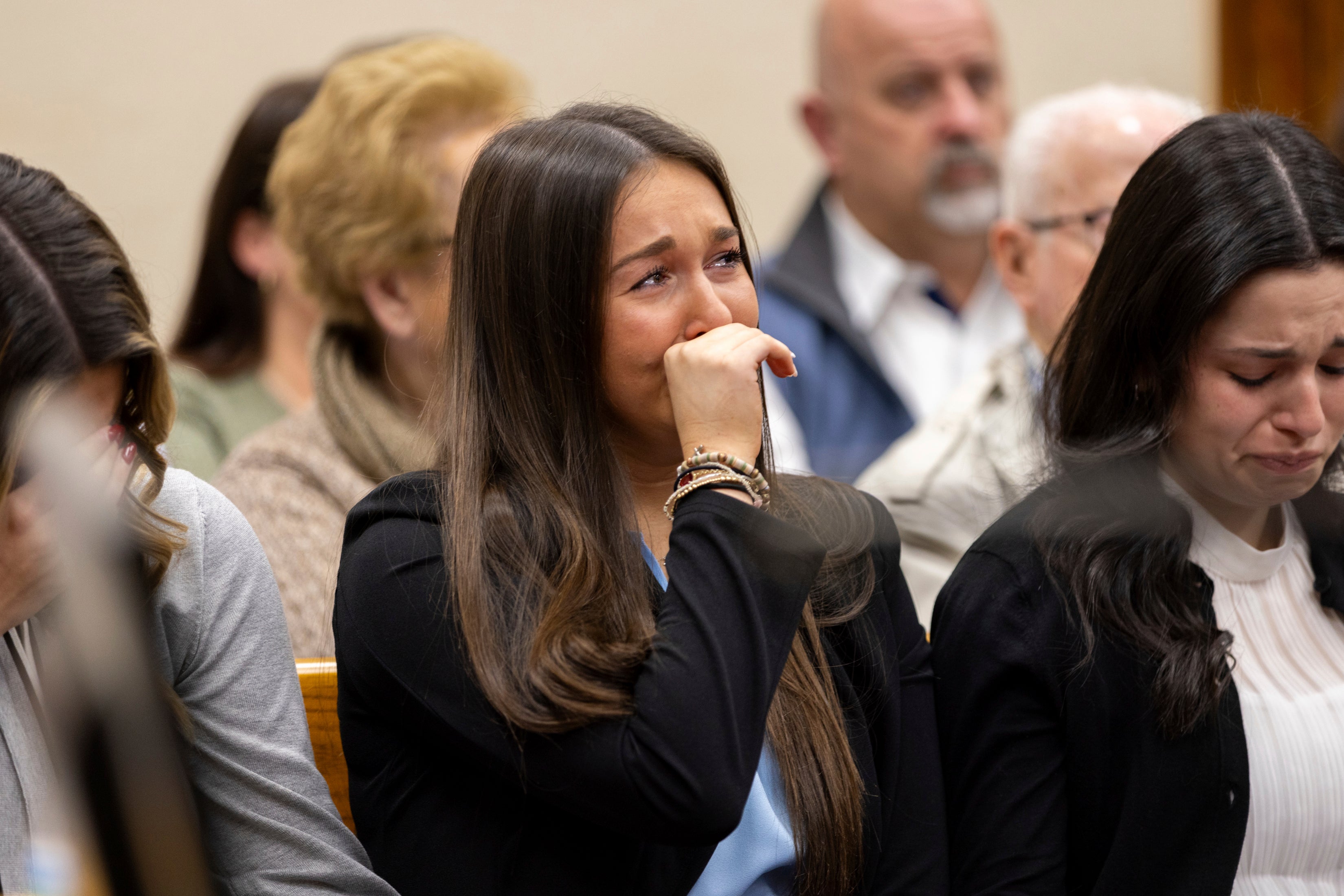 Lauren Phillips, the younger sister of Laken Riley, becomes emotional during the trial.