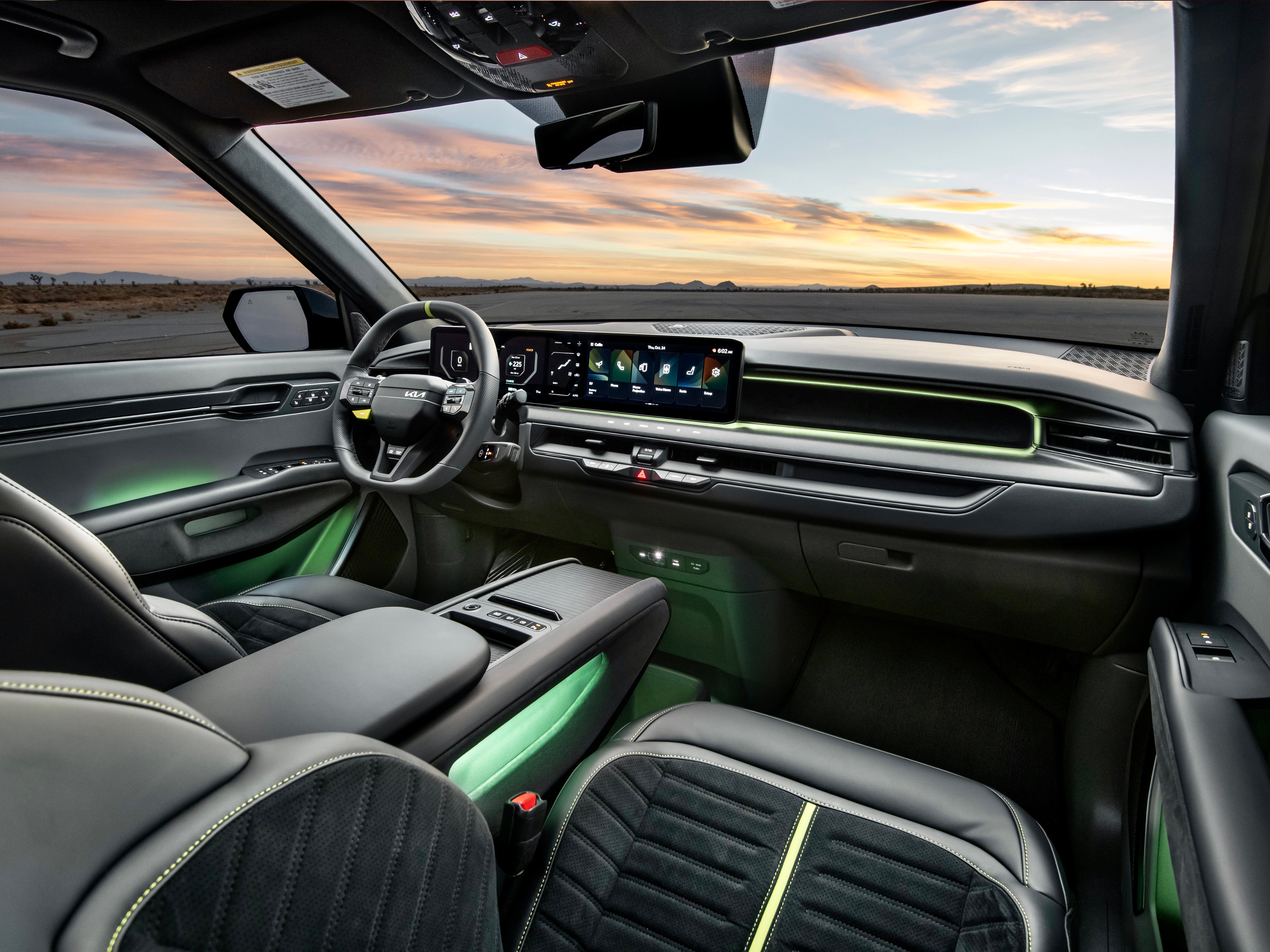 The Kia EV9 GT interior features green trim and new sports seats