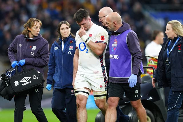 <p>Tom Curry was helped off the pitch after his latest concussion against Australia </p>