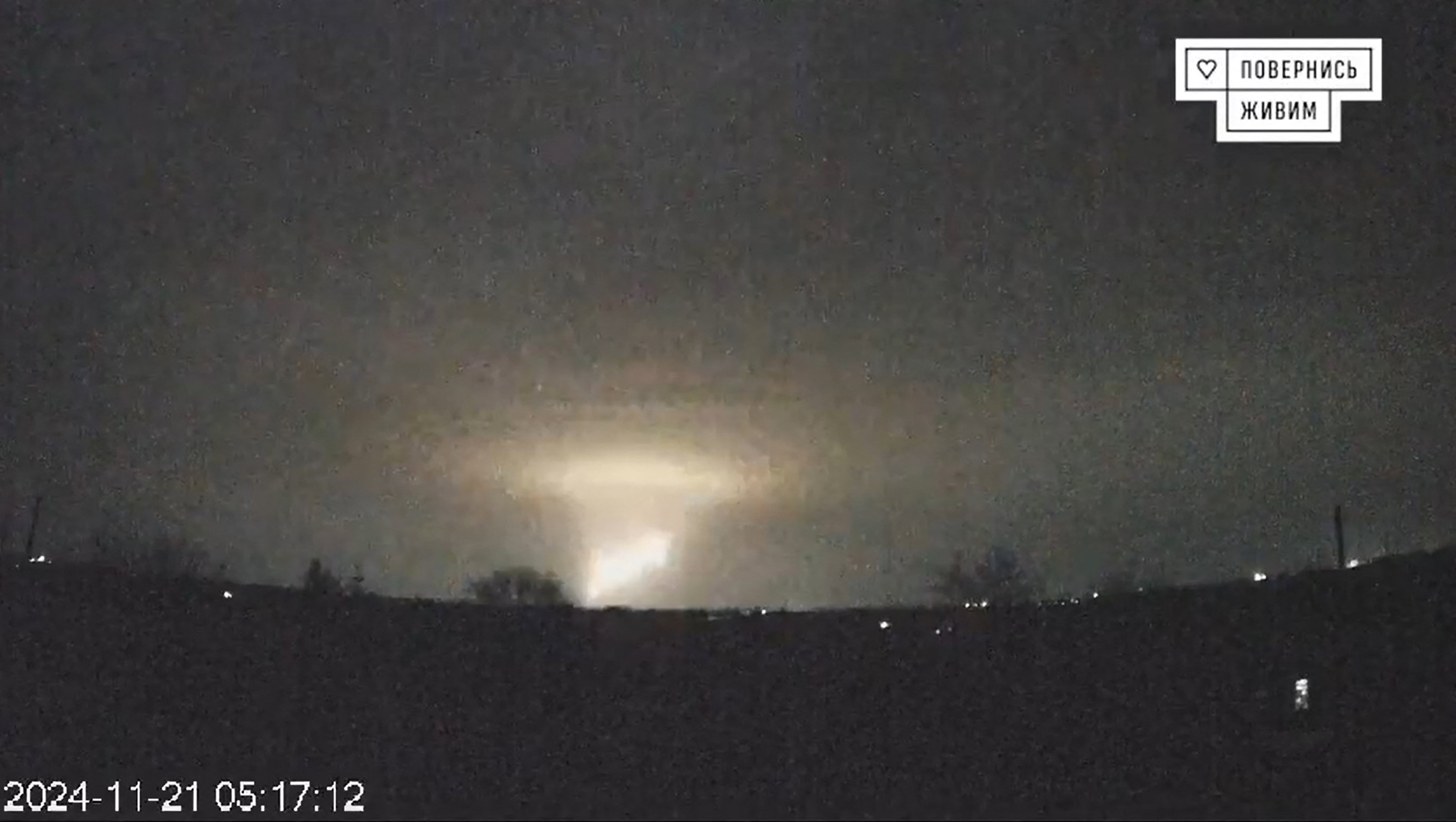 Flashes over Dnipro following what Russia said was a barrage of medium-range ballistic missiles