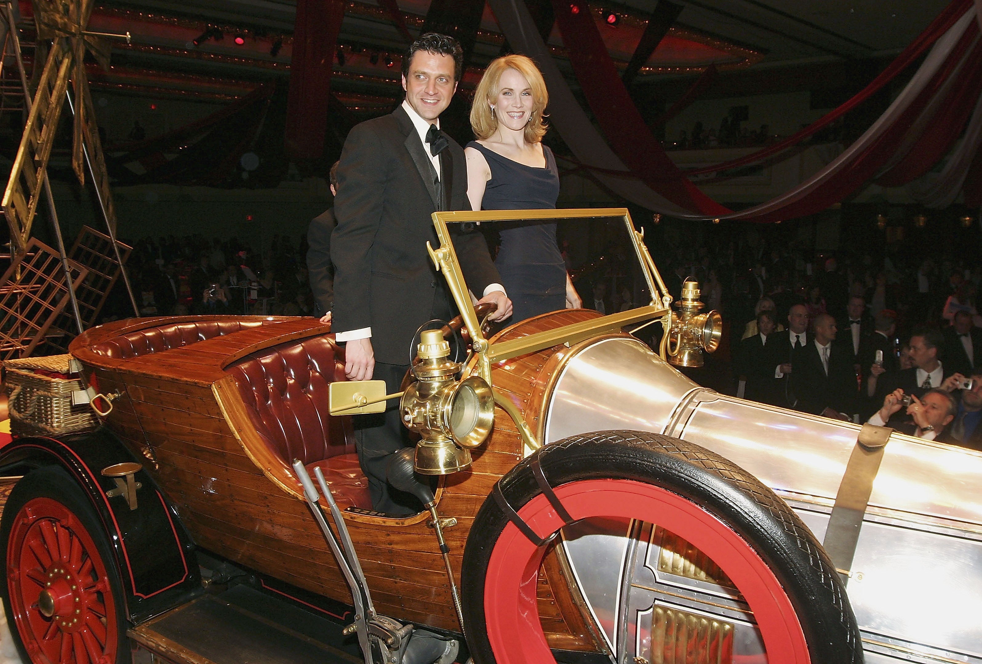 Actors Raul Esparza and Erin Dilly pose with the real star of the show, the flying car, at the opening night of ‘Chitty Chitty Bang Bang’ in 2005