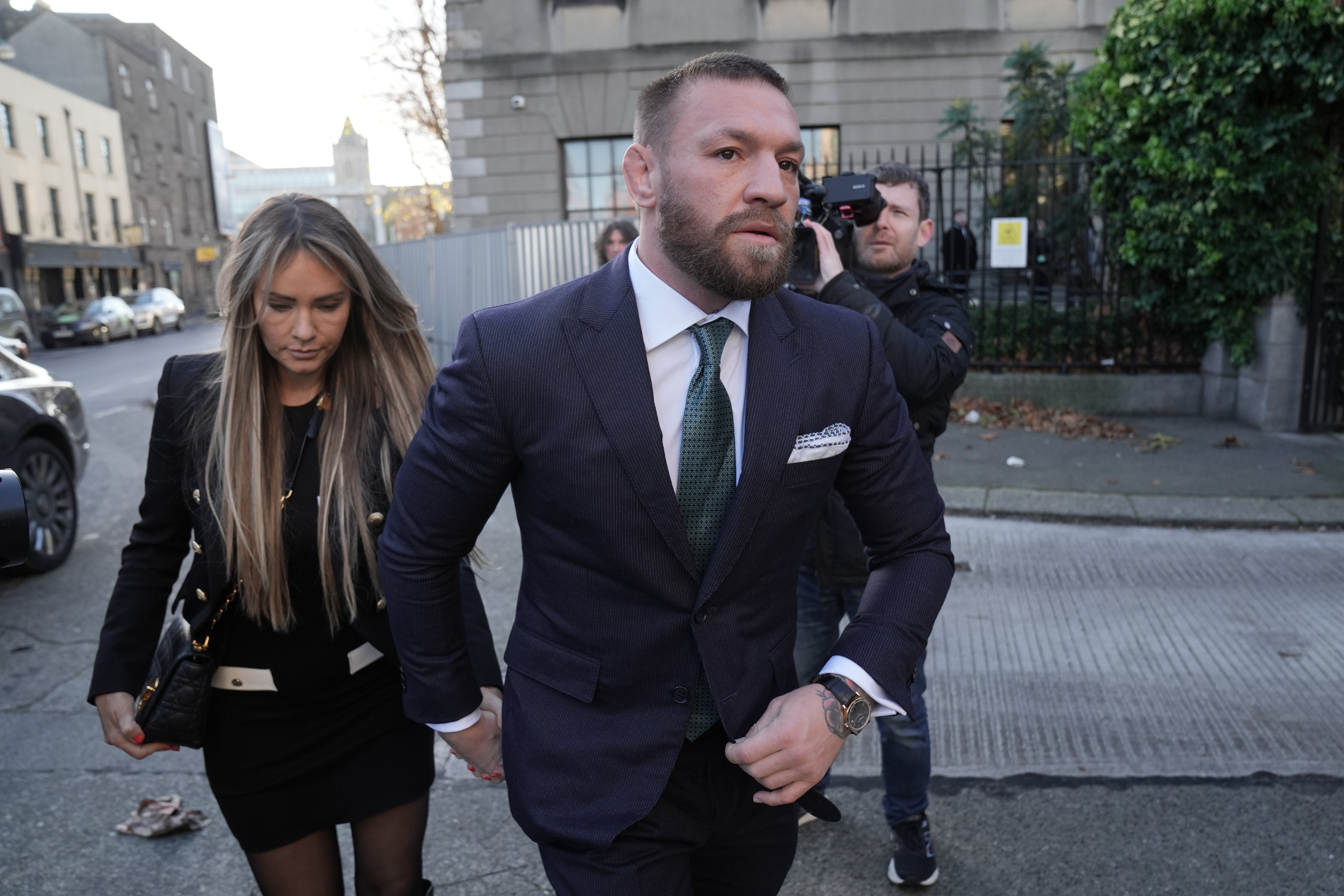 Conor McGregor outside the High Court in Dublin with his fiancee Dee Devlin