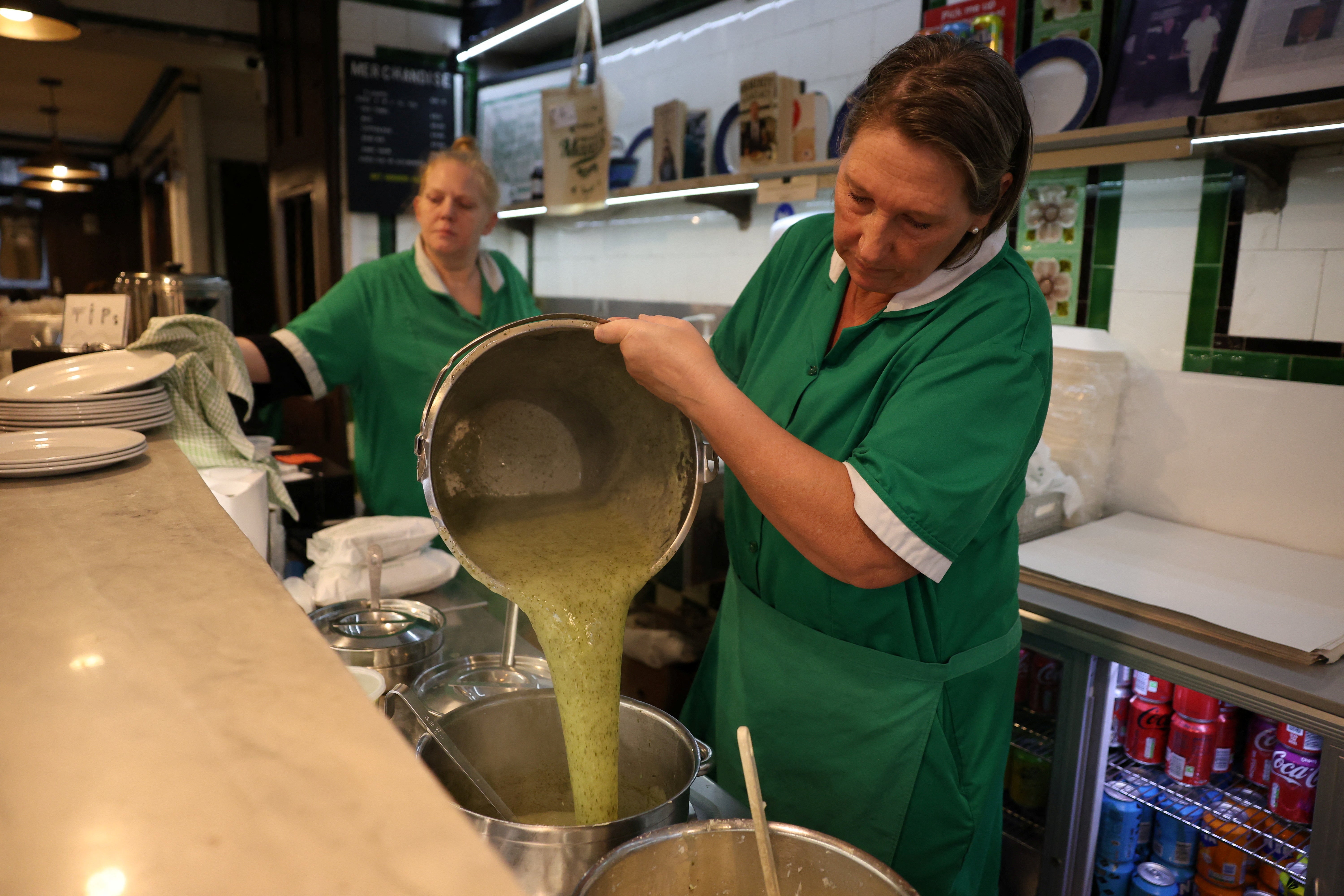 June Thurkle prepares liquor sauce at M. Manze, in London, Britain, November 21, 2024. REUTERS/Mina Kim