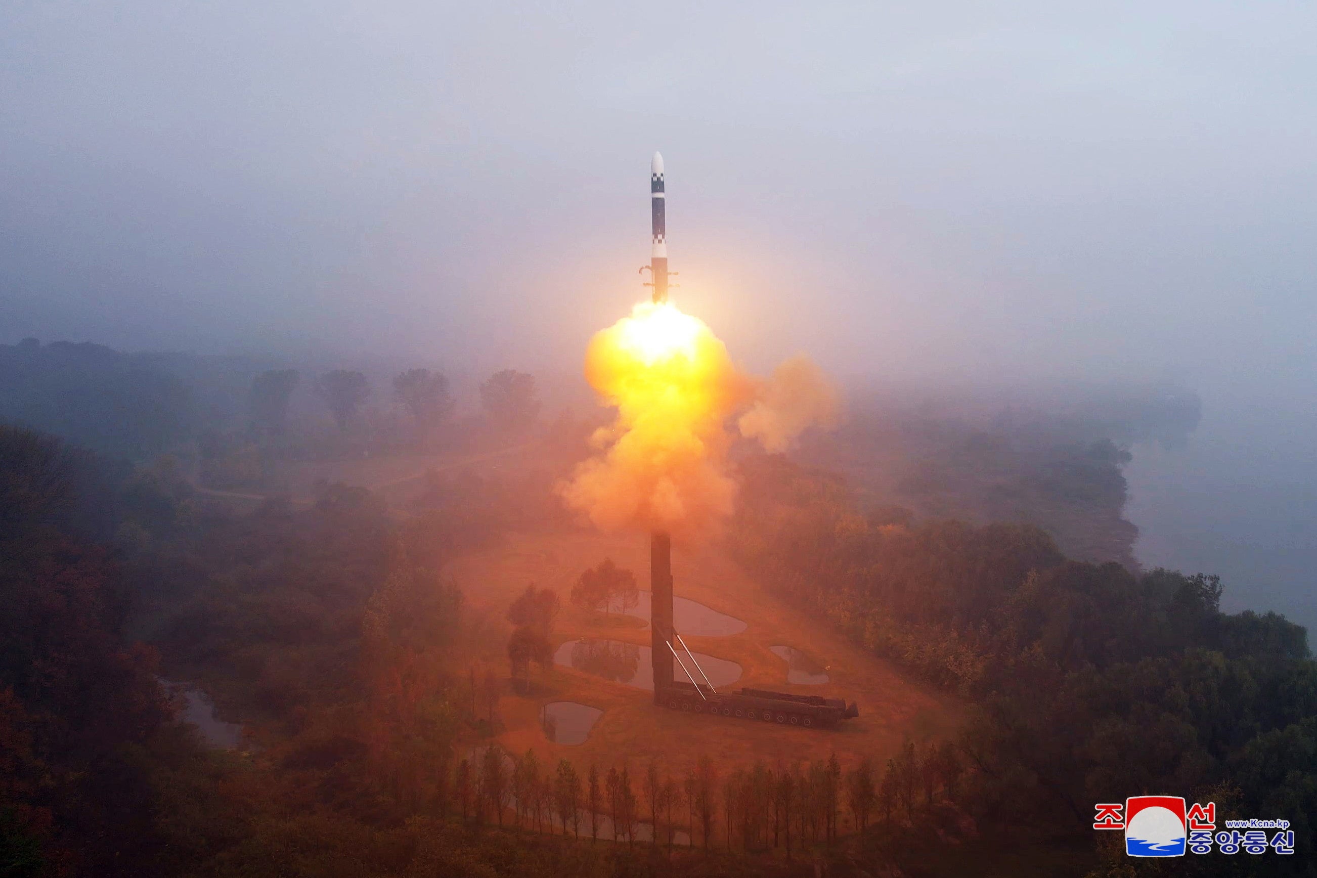 A photo released by the official North Korean Central News Agency (KCNA) shows North Korea conducting a test fire of its latest ICBM, Hwasongpho-19, at an undisclosed location in North Korea