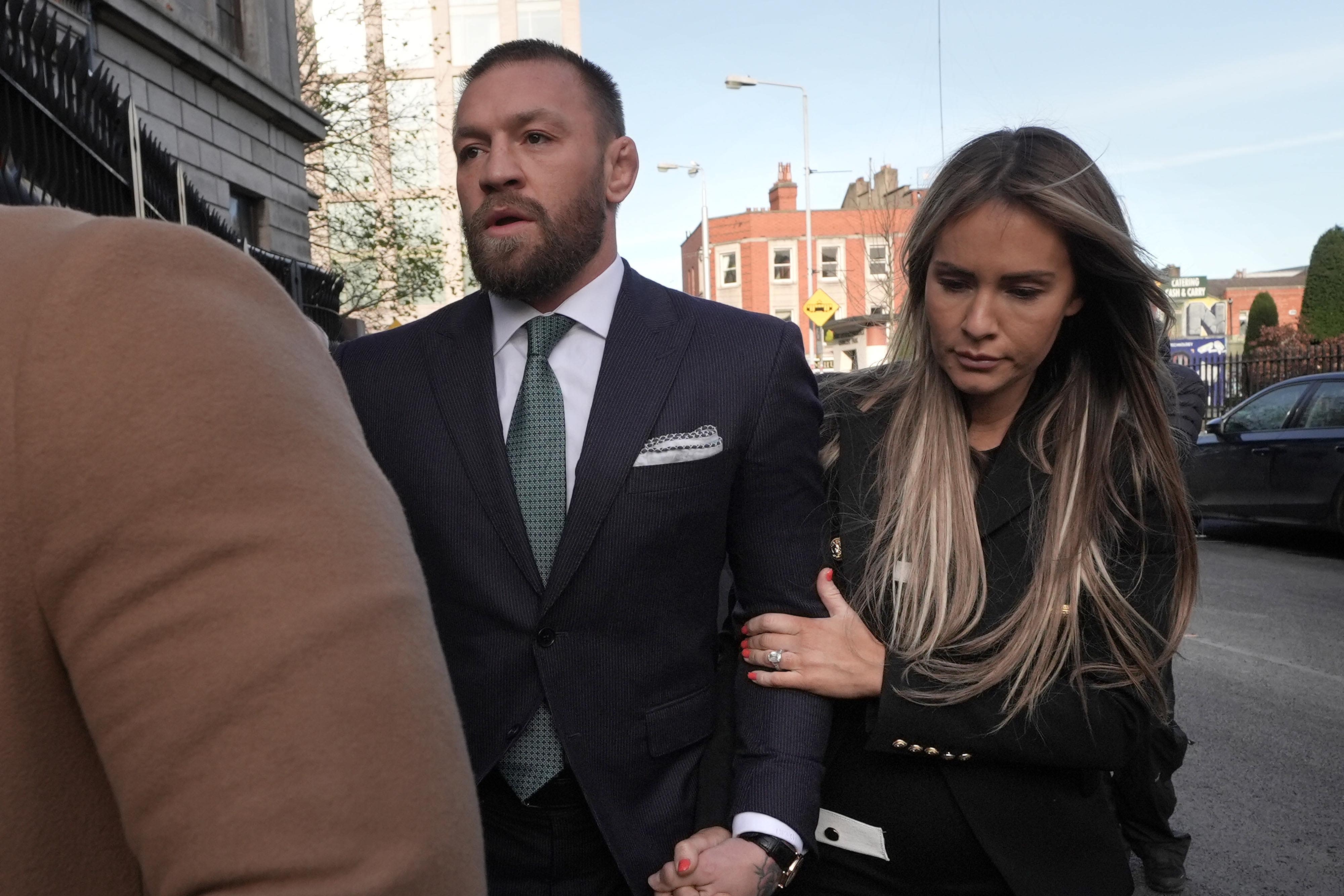 Conor McGregor and partner Dee Devlin outside the High Court in Dublin (Brian Lawless/PA)