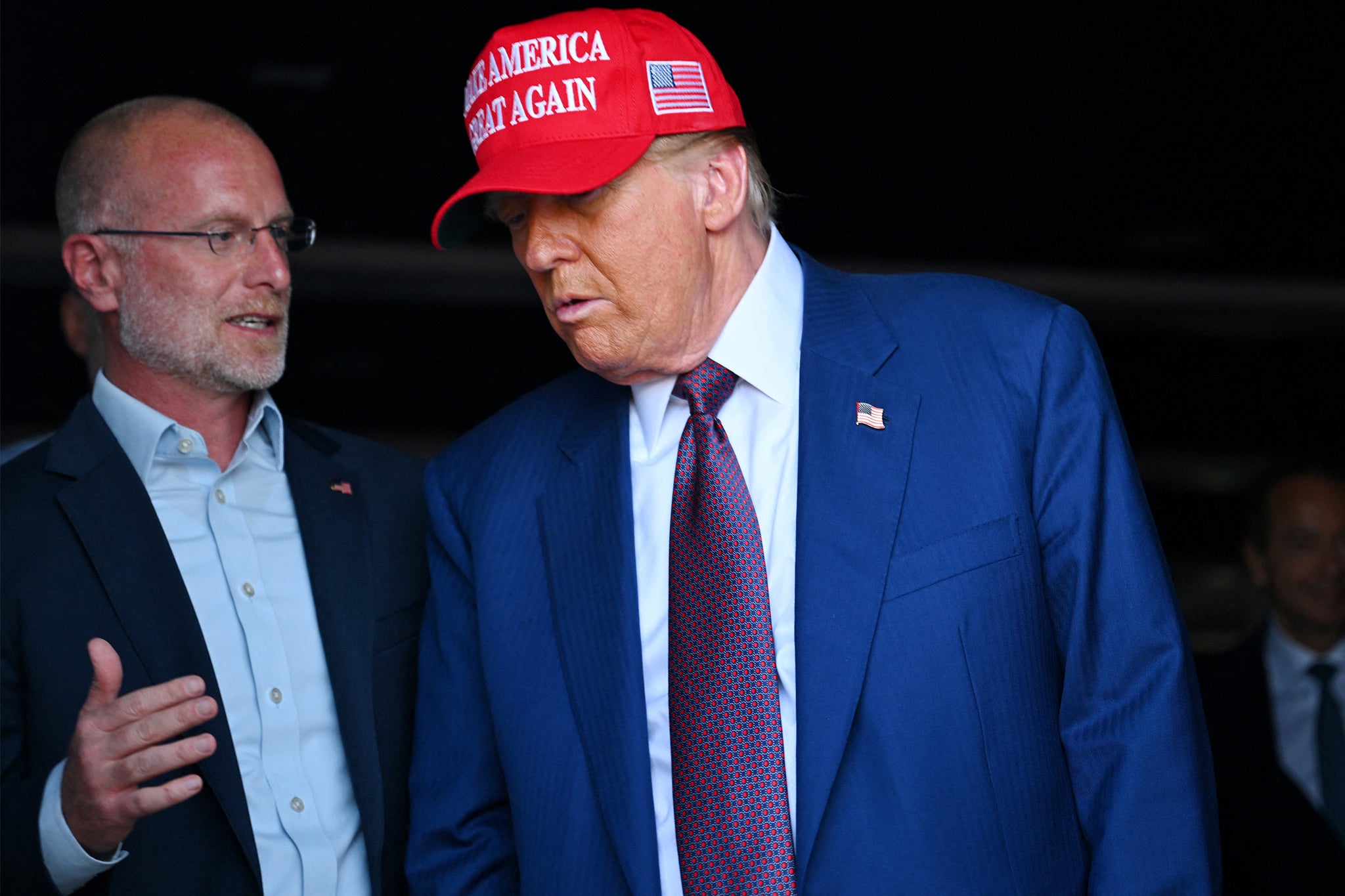 FCC Chairman Brendan Carr, seen here with Donald Trump, is investigating a San Francisco radio station over its reporting on an ICE raid.
