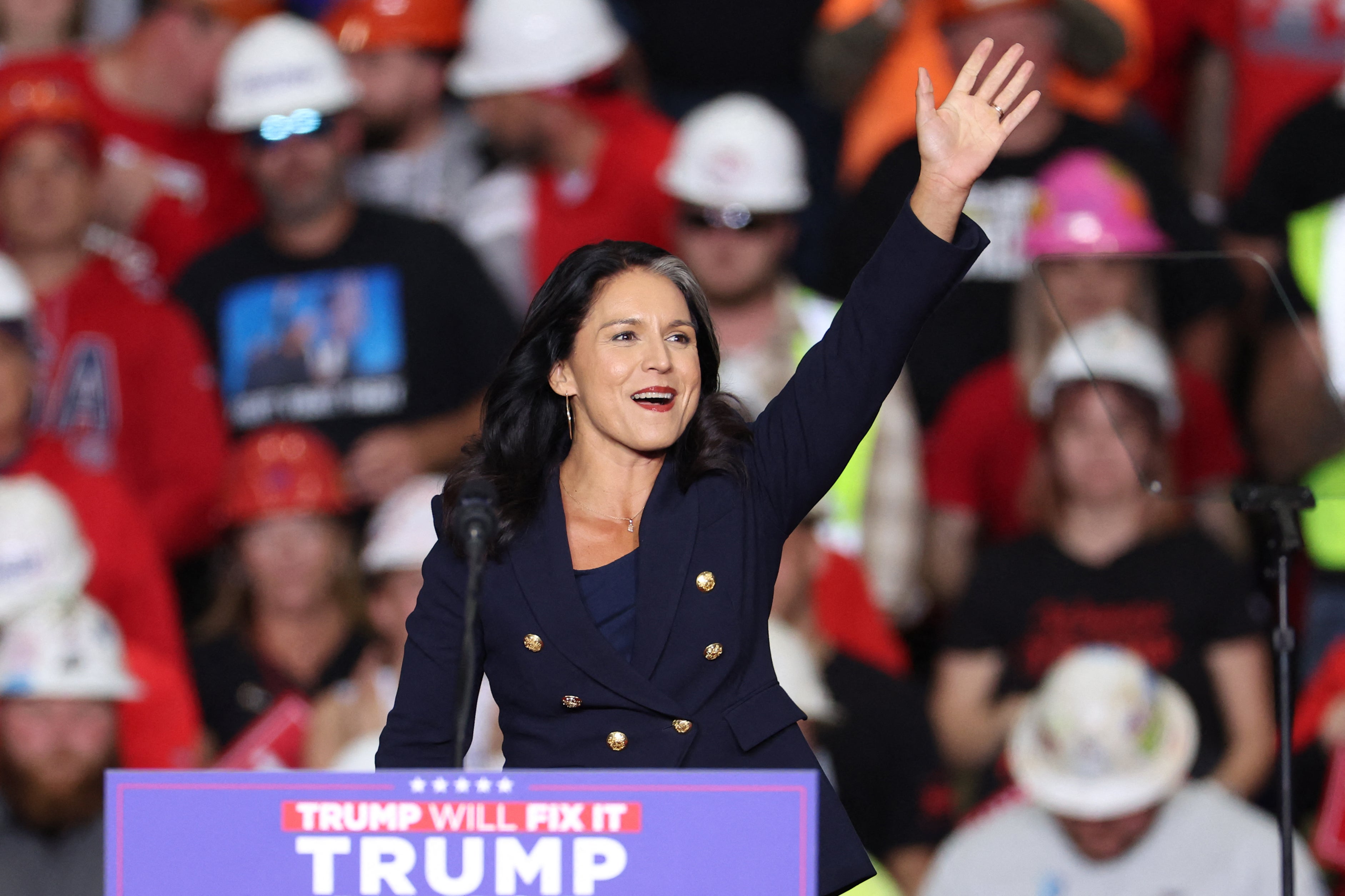 Tulsi Gabbard waves as she arrives to speak during a campaign rally for Donald Trump at PPG Paints Arena in Pittsburgh, Pennsylvania, on November 4, 2024. She was briefly placed on a TSA watchlist