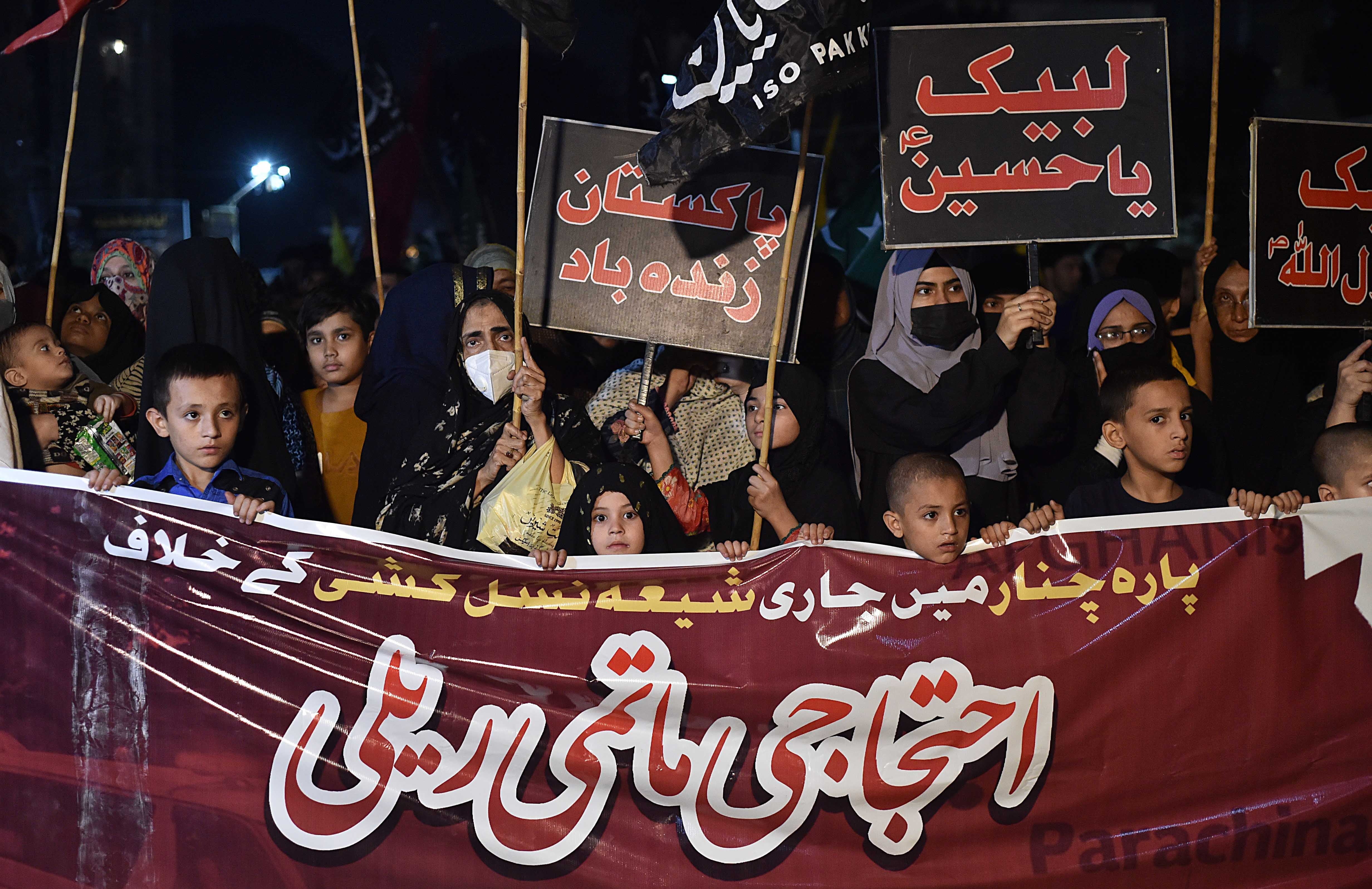 Shia Muslims attend a protest against an attack on members of the minority community in Kurram