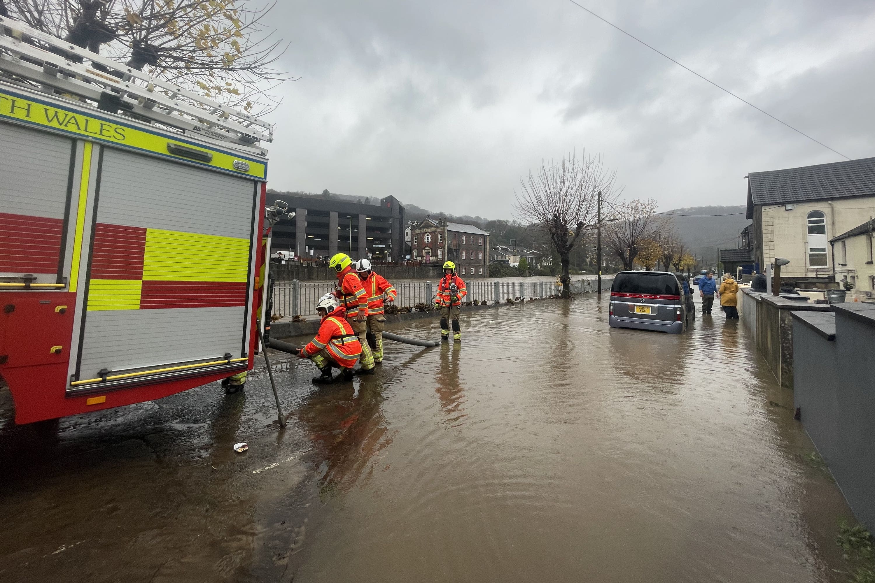 Firefighters have been pictured pumping water from a street by the River Taff in Pontypridd after homes there were flooded by rising waters