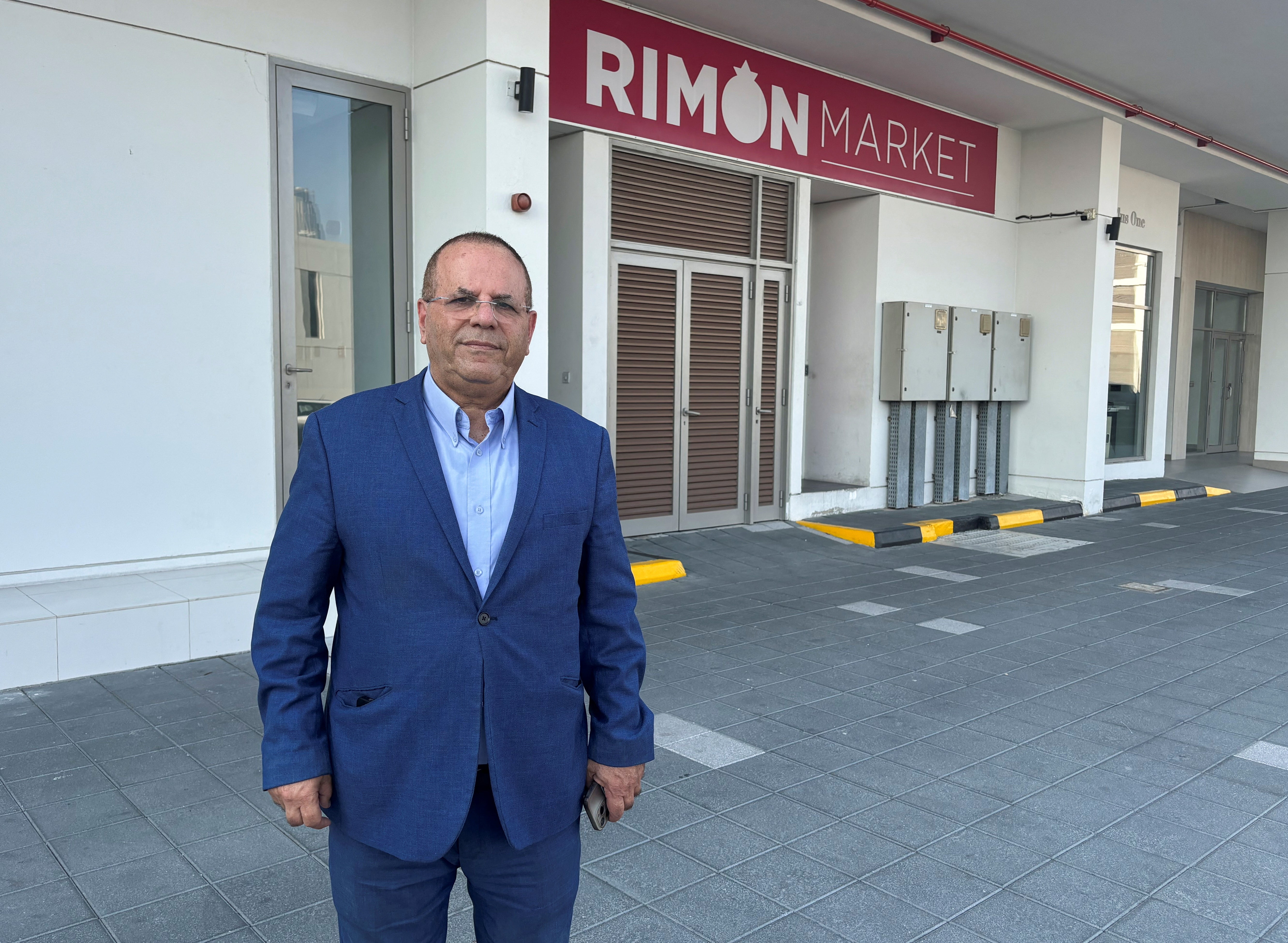 Ayoob Kara outside the Rimon Market kosher store which was managed by Zvi Kogan