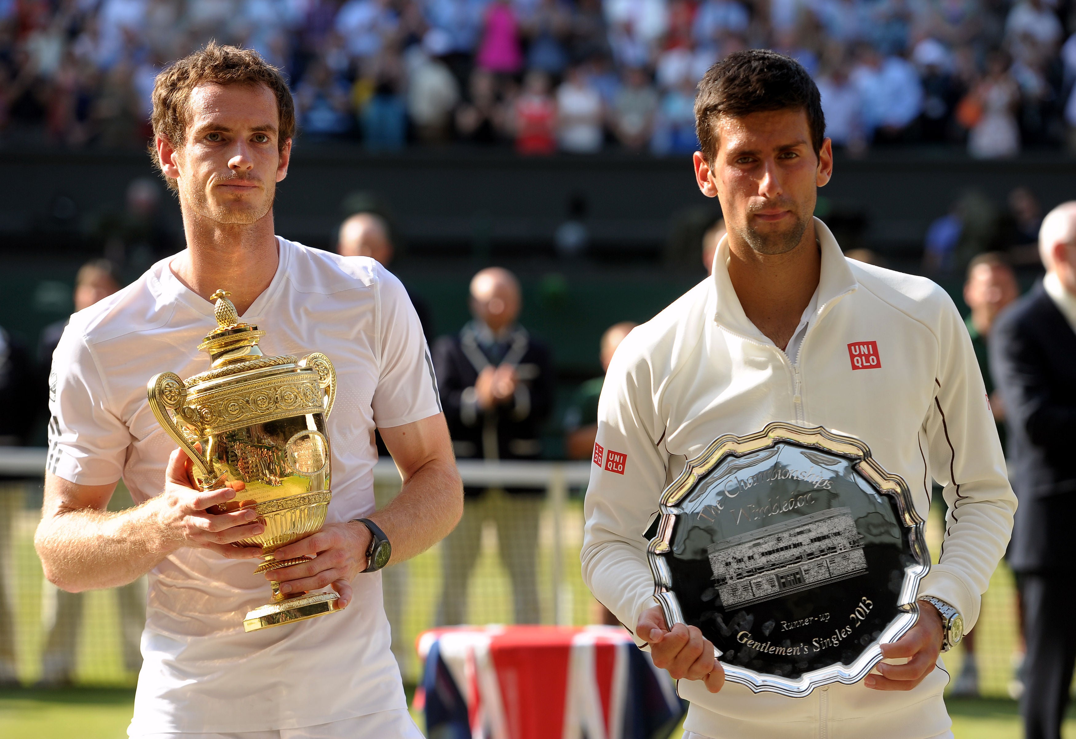 Andy Murray (left) celebrated with the Wimbledon trophy after beating Novak Djokovic in the final in 2013 (Adam Davy/PA)