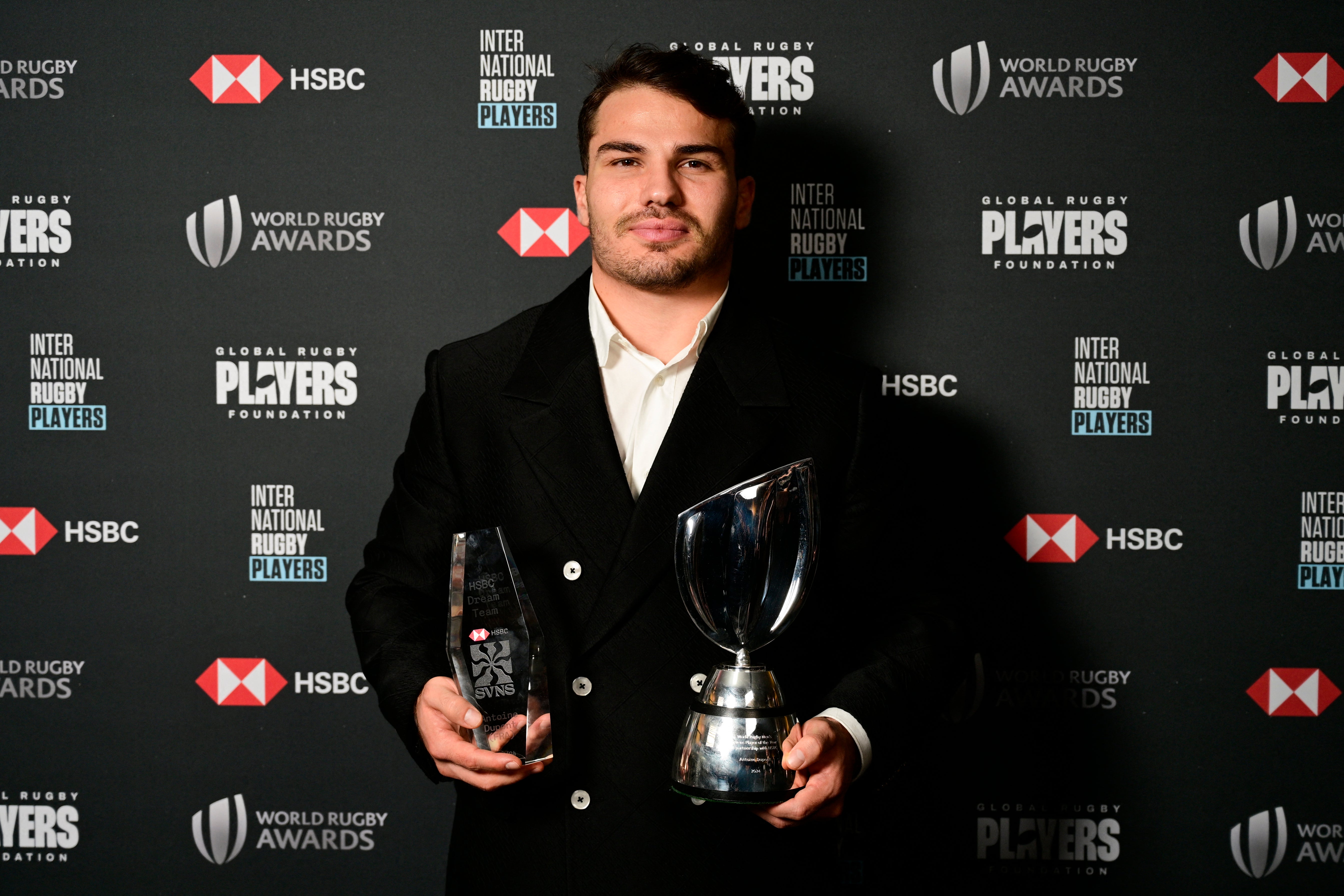 France's Antoine Dupont poses with trophy after he receives the Men's Sevens Player of the Year